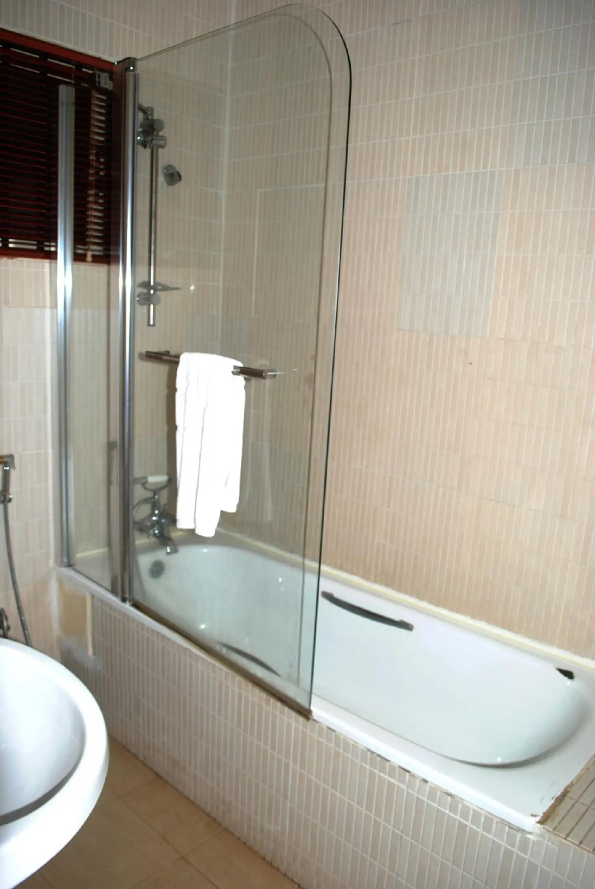 Bathroom in Grand Inn & Suites Bathroom in Grand Inn & Suites