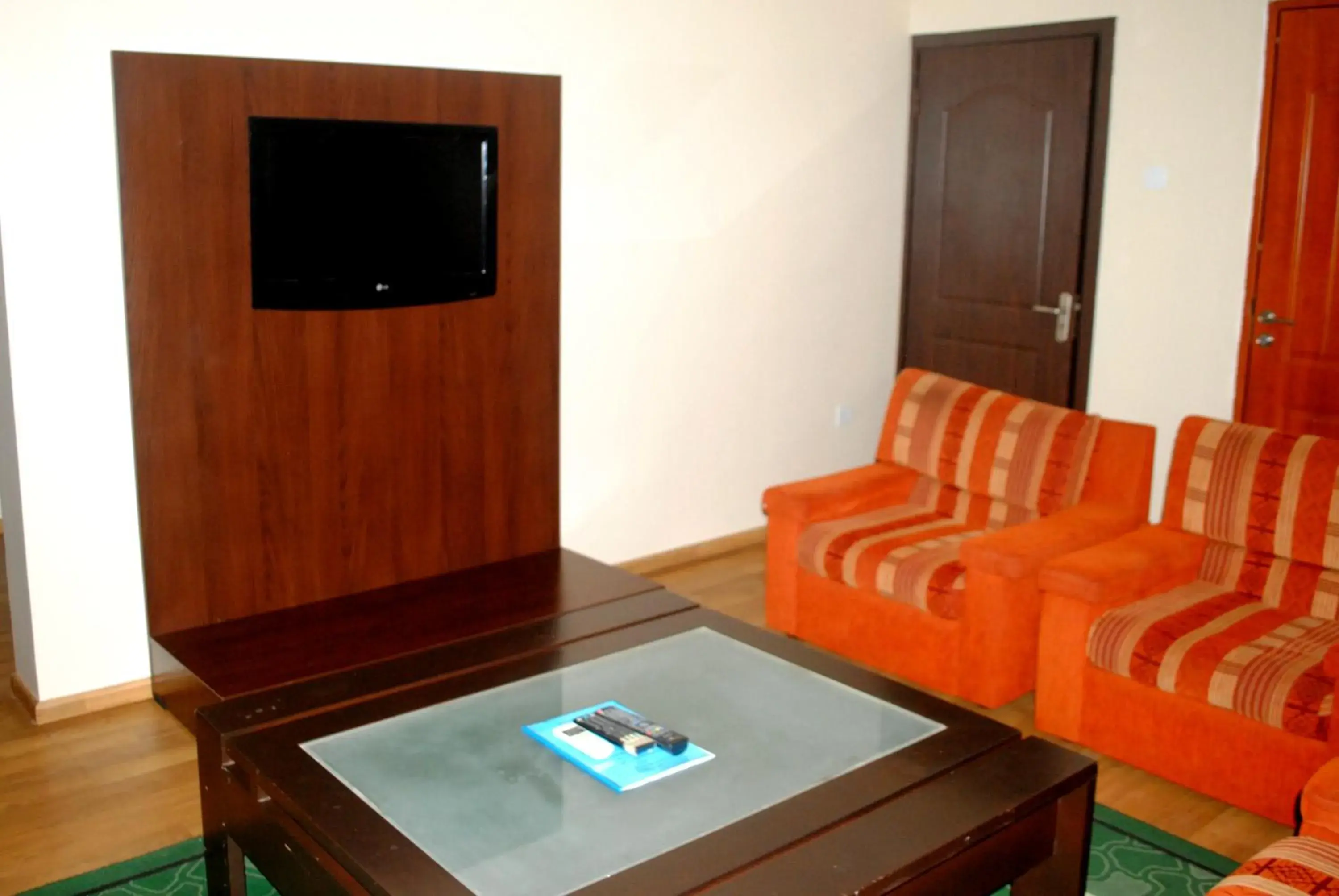 Living room in Grand Inn & Suites Living room in Grand Inn & Suites