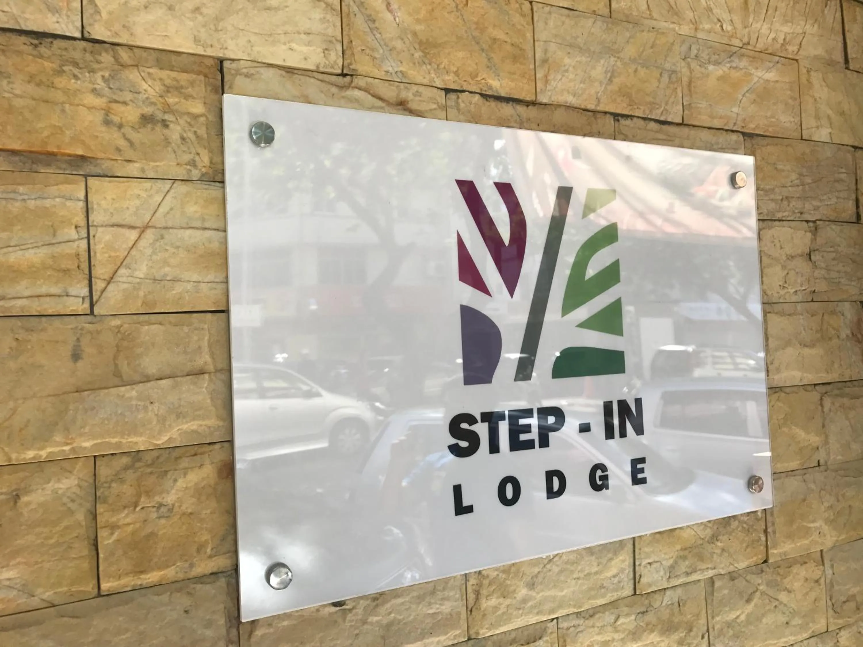 Property logo or sign in Step-in Lodge