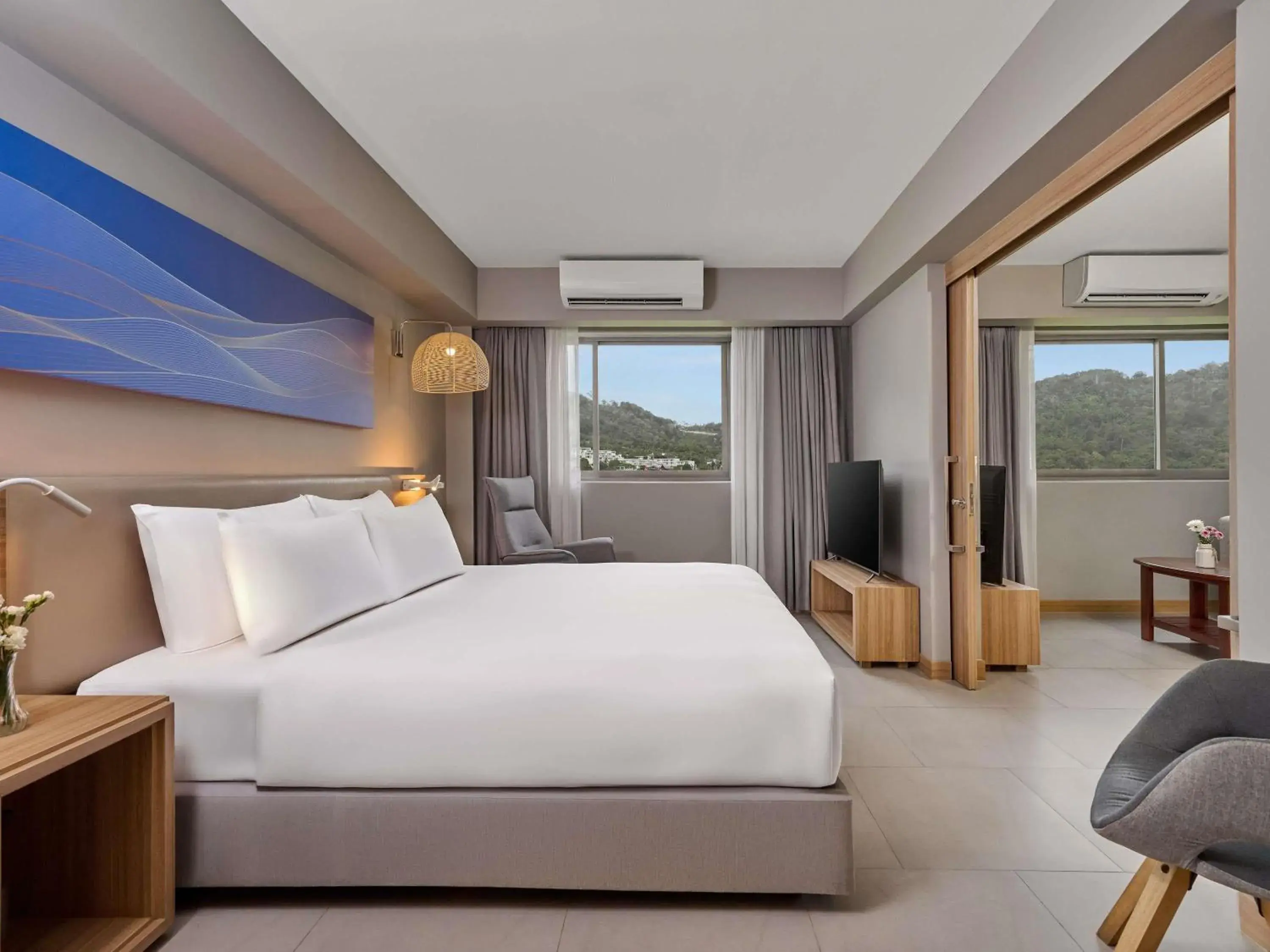 Two-Bedroom Suite with One Double and Two Single Beds in Mercure Phuket Patong Journeyhub Two-Bedroom Suite with One Double and Two Single Beds in Mercure Phuket Patong Journeyhub