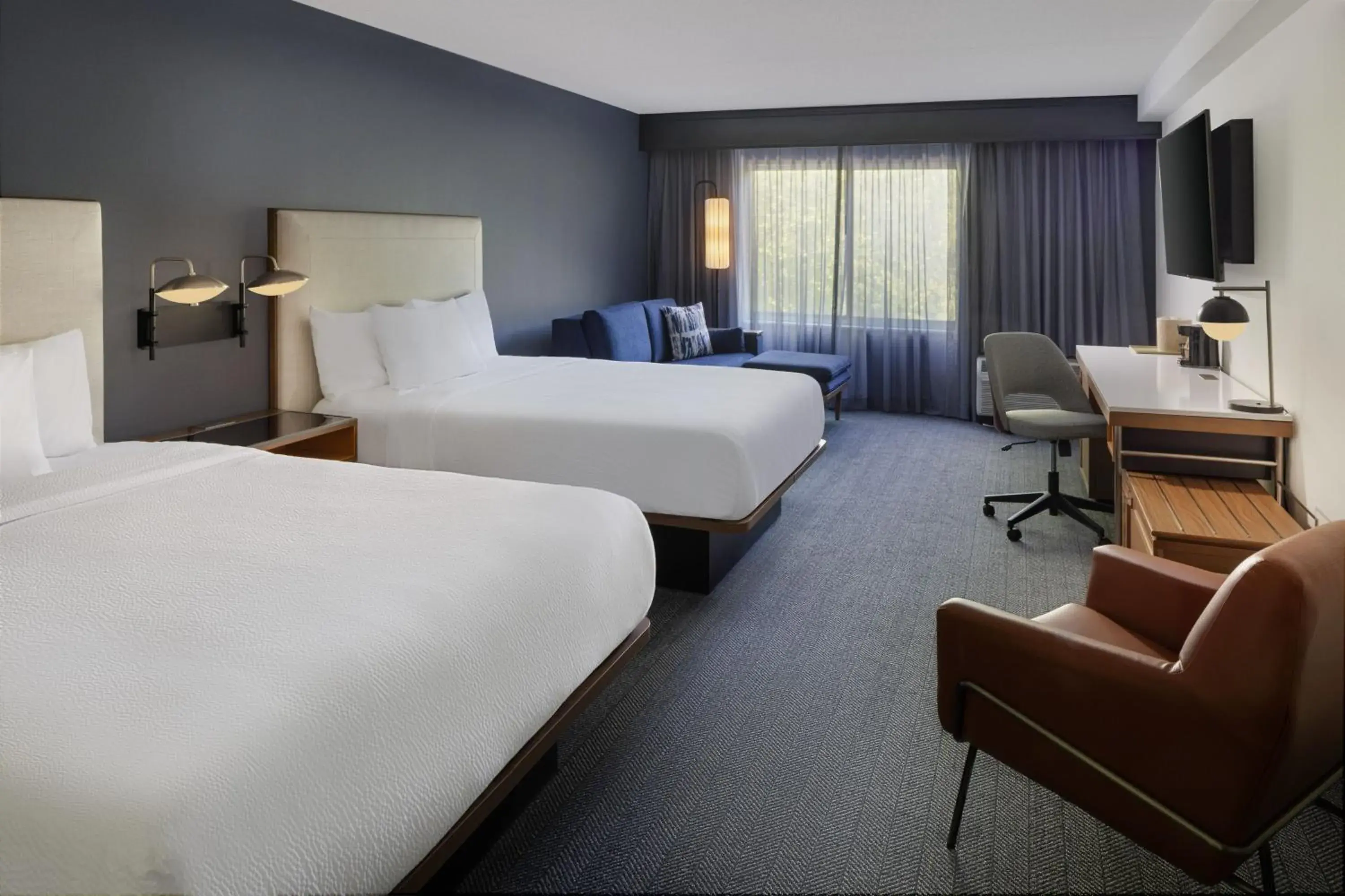 Deluxe Queen Room with Two Queen Beds and Sofa Bed in Courtyard Edison Woodbridge Deluxe Queen Room with Two Queen Beds and Sofa Bed in Courtyard Edison Woodbridge