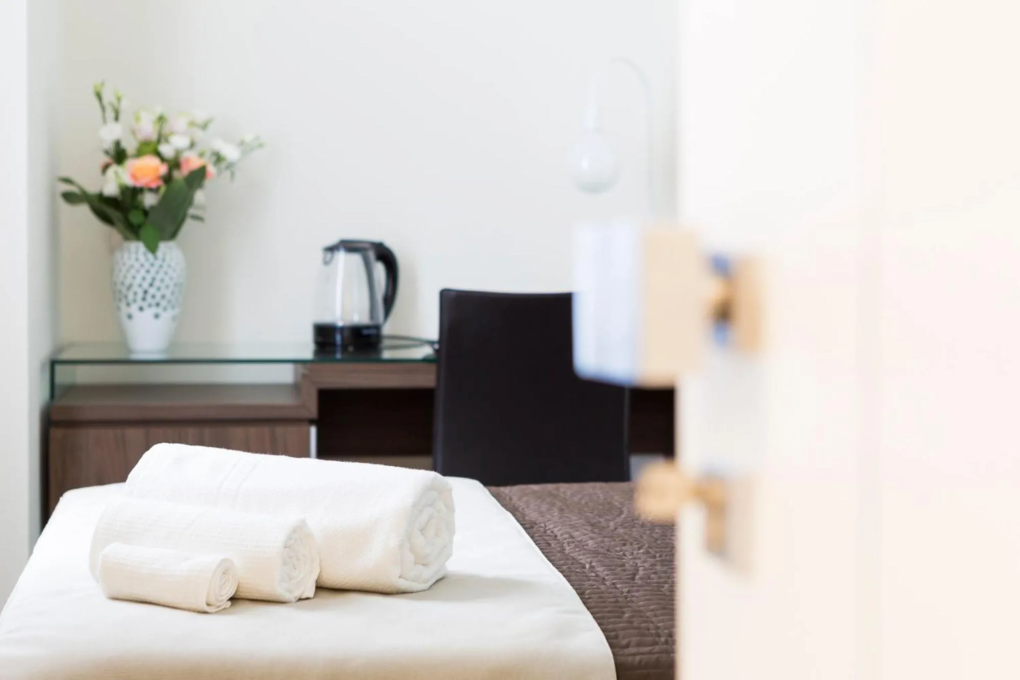 Bed in Rhome Suites