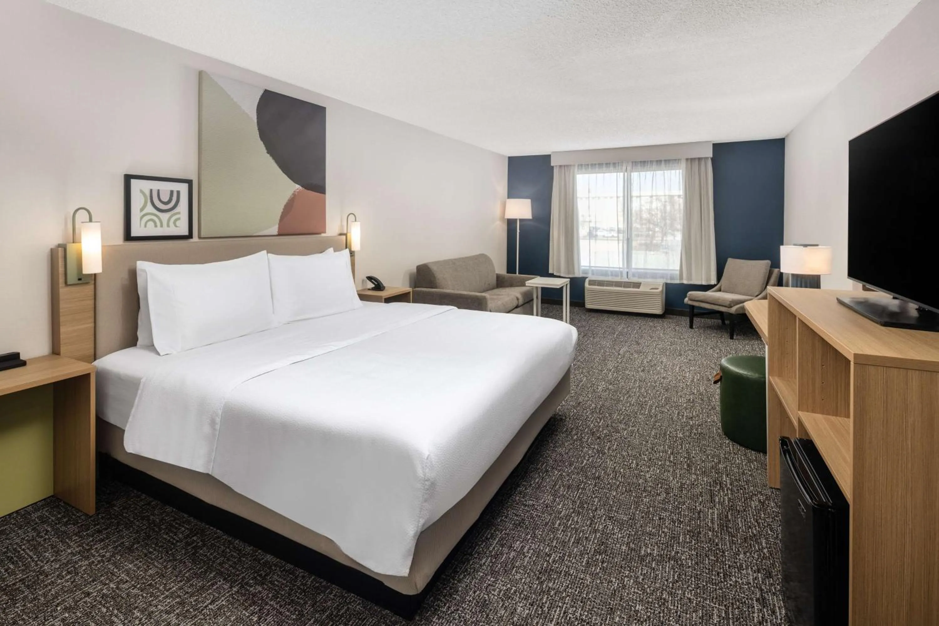 Living room, Bed in Spark by Hilton Salt Lake City Airport