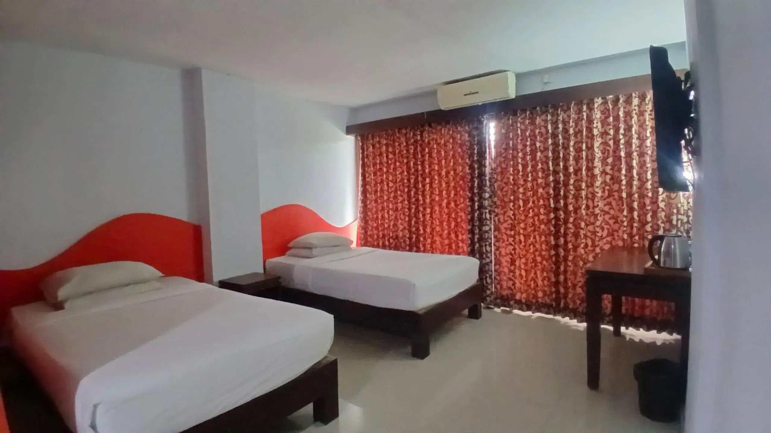 Bedroom, Bed in Nirmala Hotel & Convention Centre Bedroom, Bed in Nirmala Hotel & Convention Centre