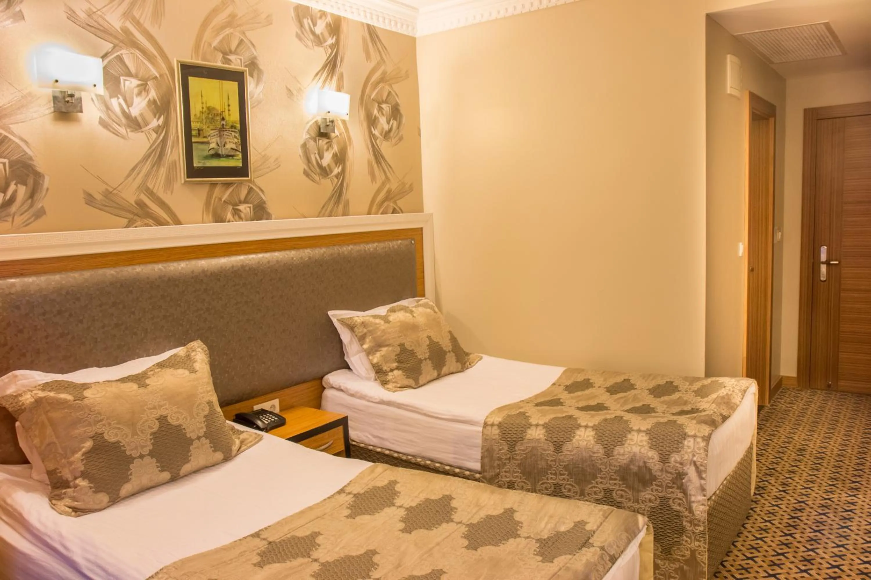 Bed in Grand Rosa Hotel