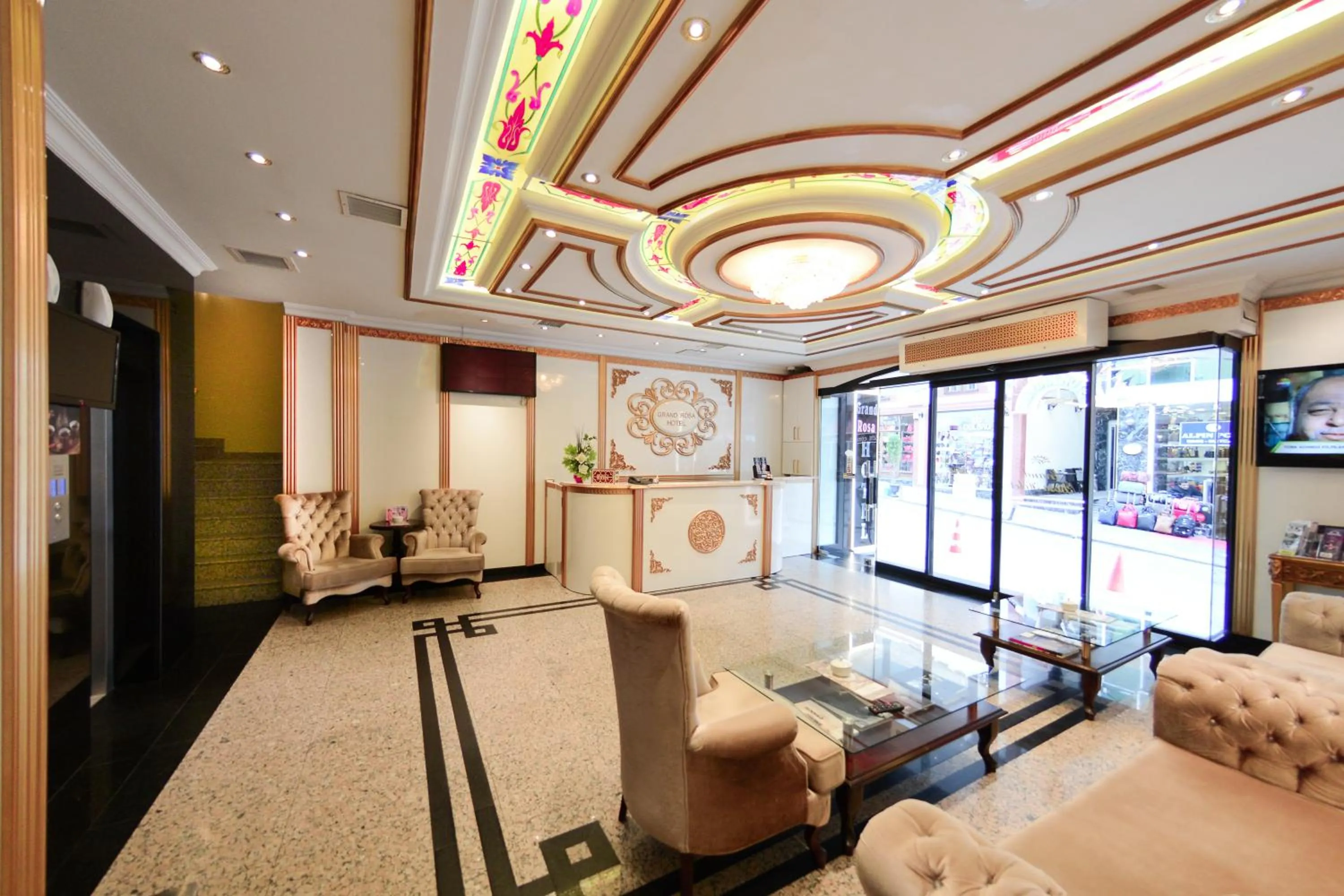 Communal lounge/ TV room in Grand Rosa Hotel