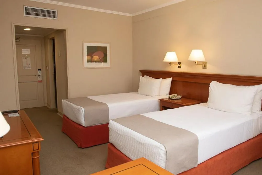 Bed in Austral Plaza Hotel