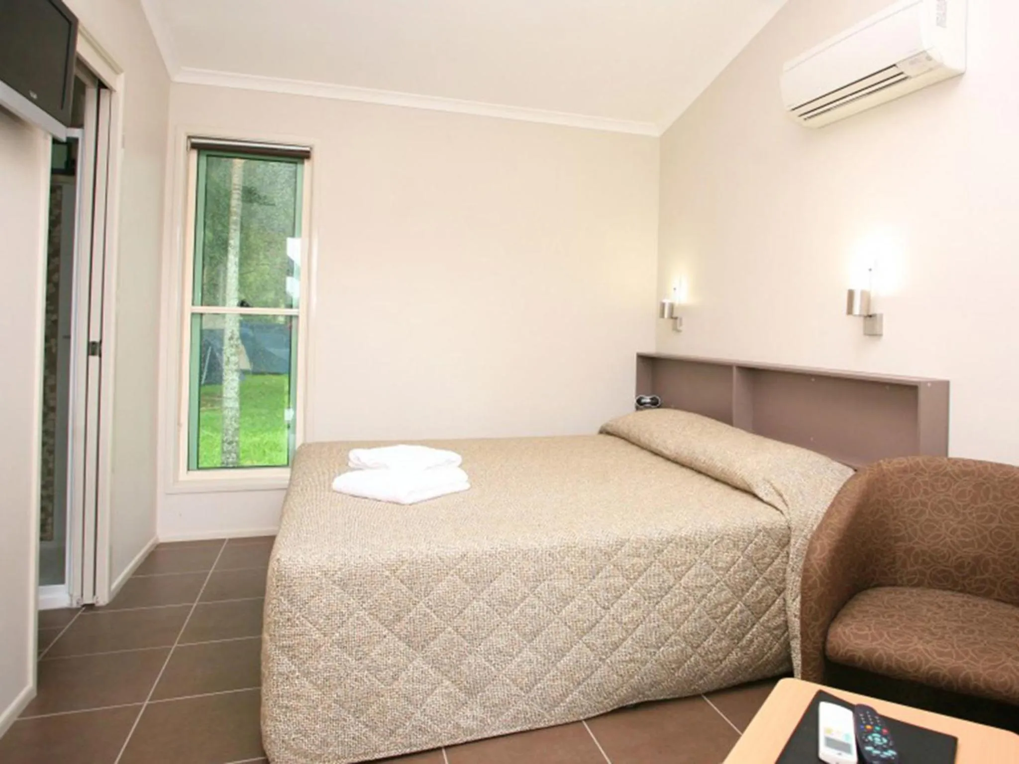 Photo of the whole room, Bed in NRMA Cairns Holiday Park