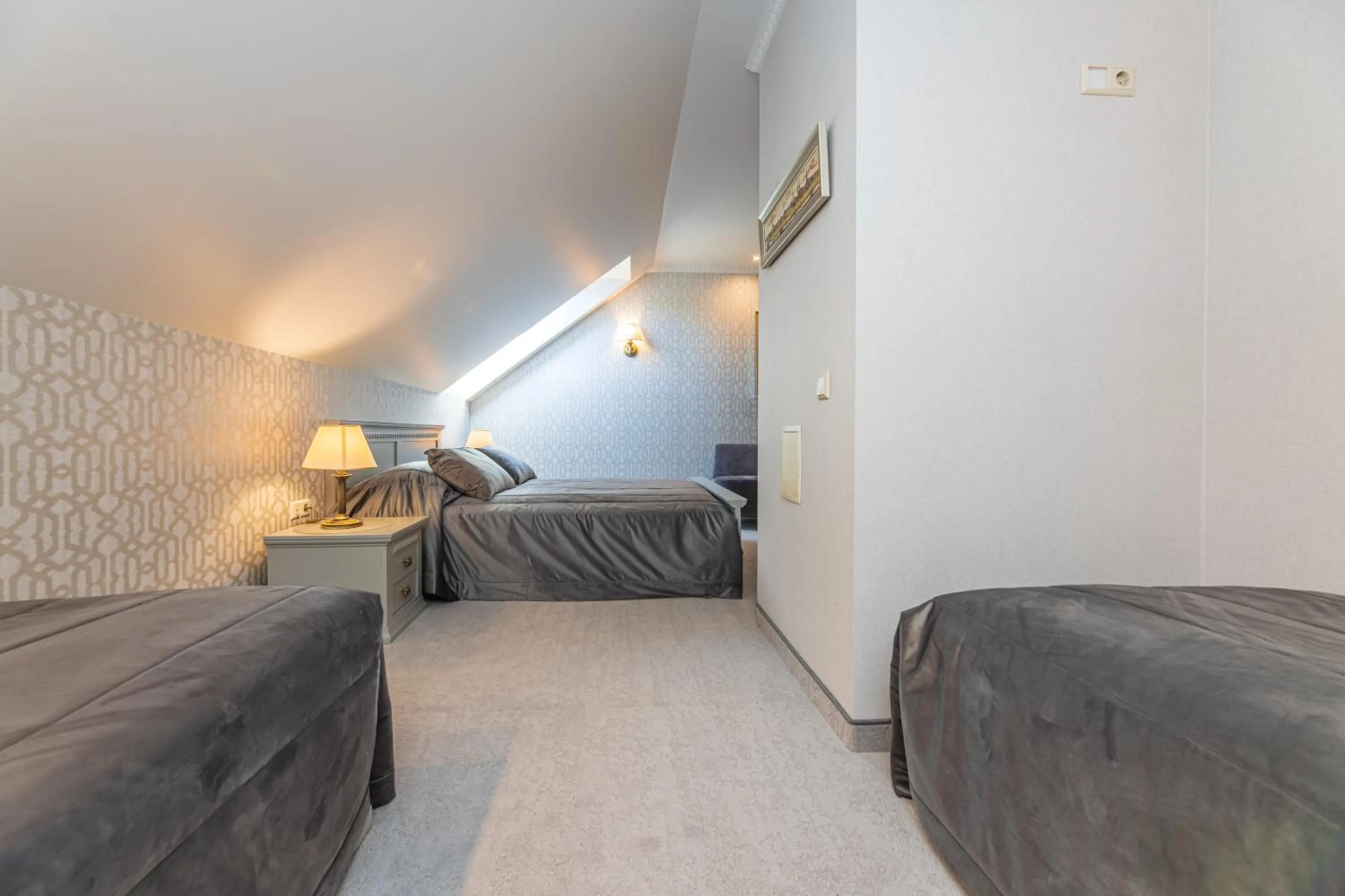 Bed in Senoji Hansa Hotel