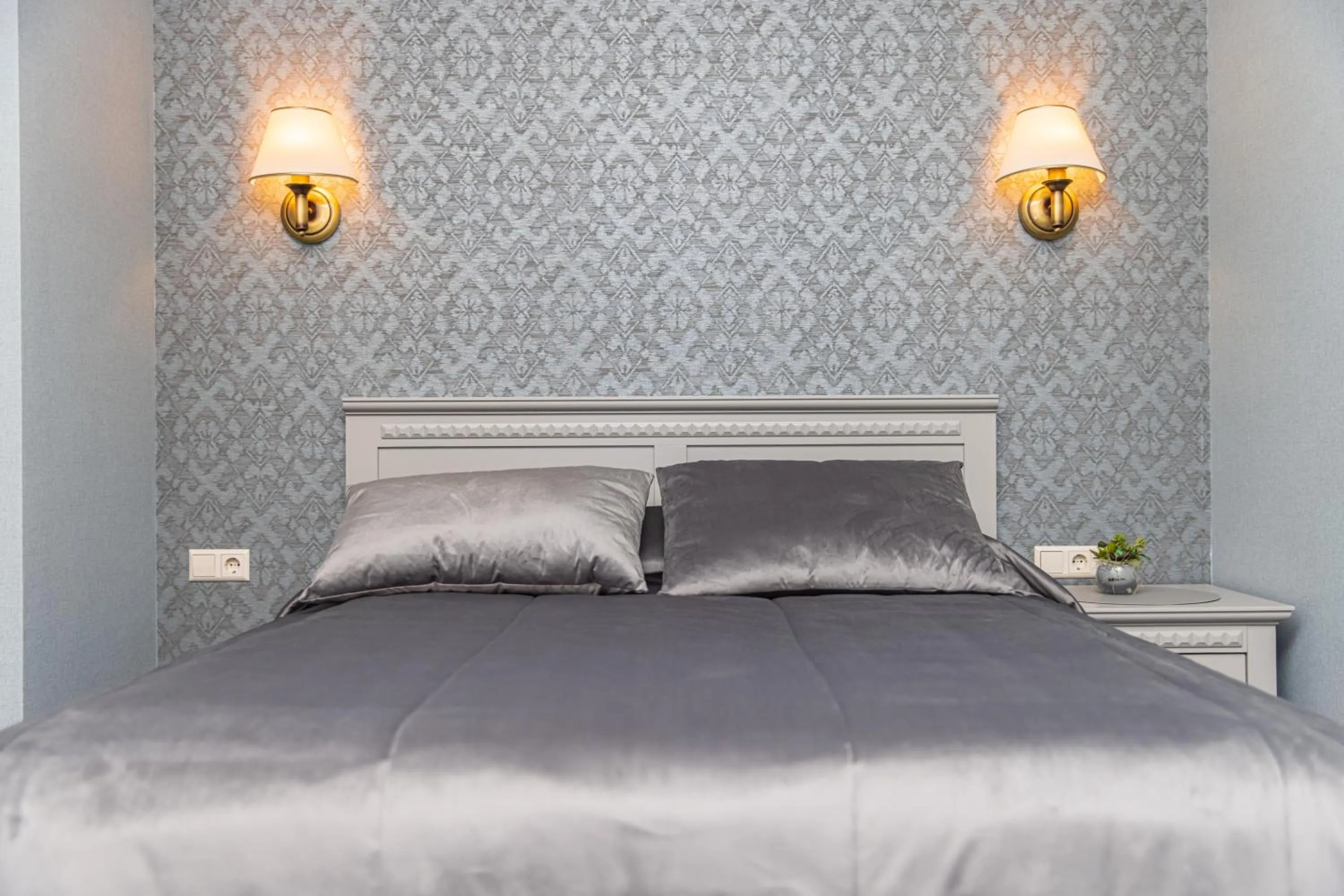 Bed in Senoji Hansa Hotel