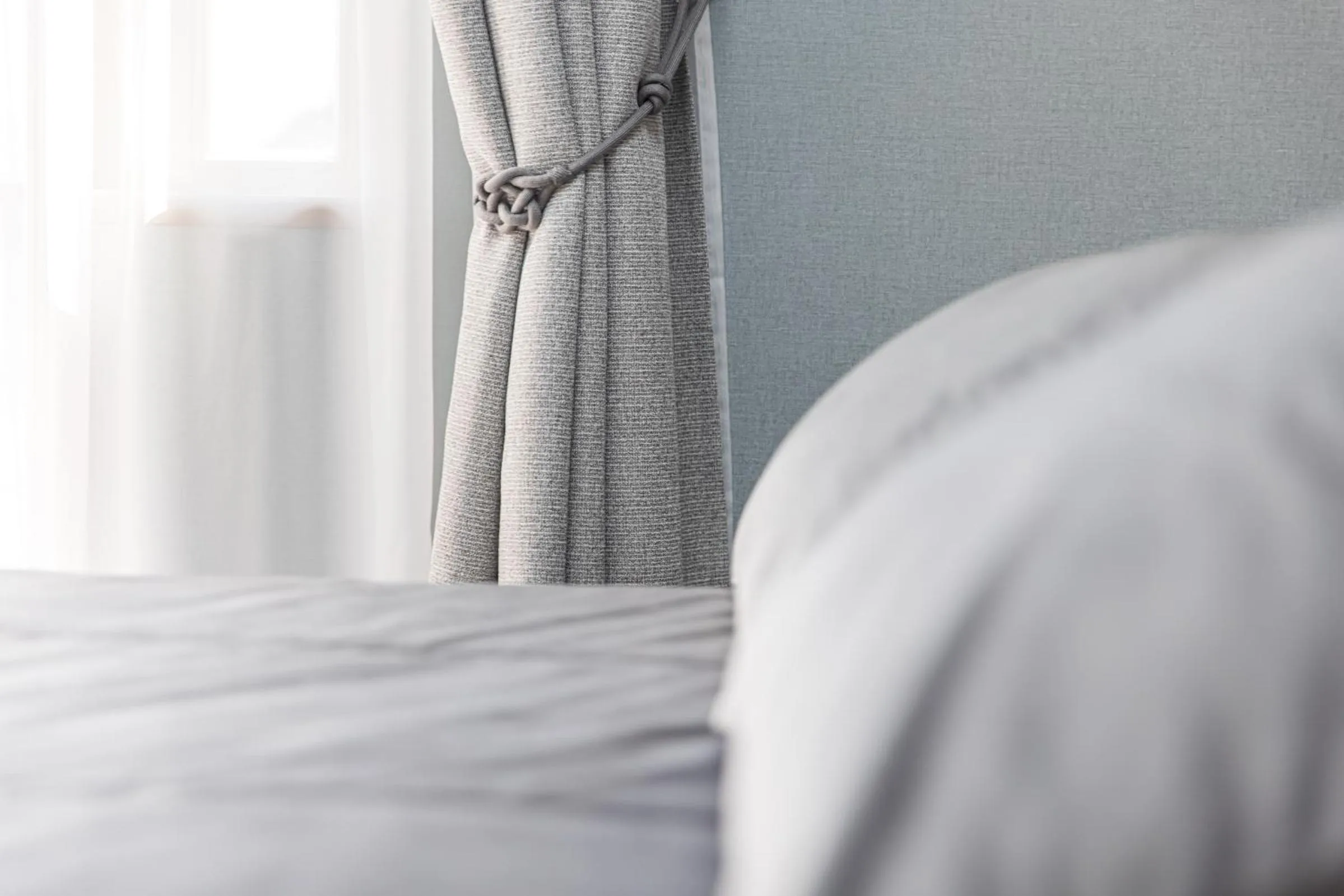 Bed in Senoji Hansa Hotel