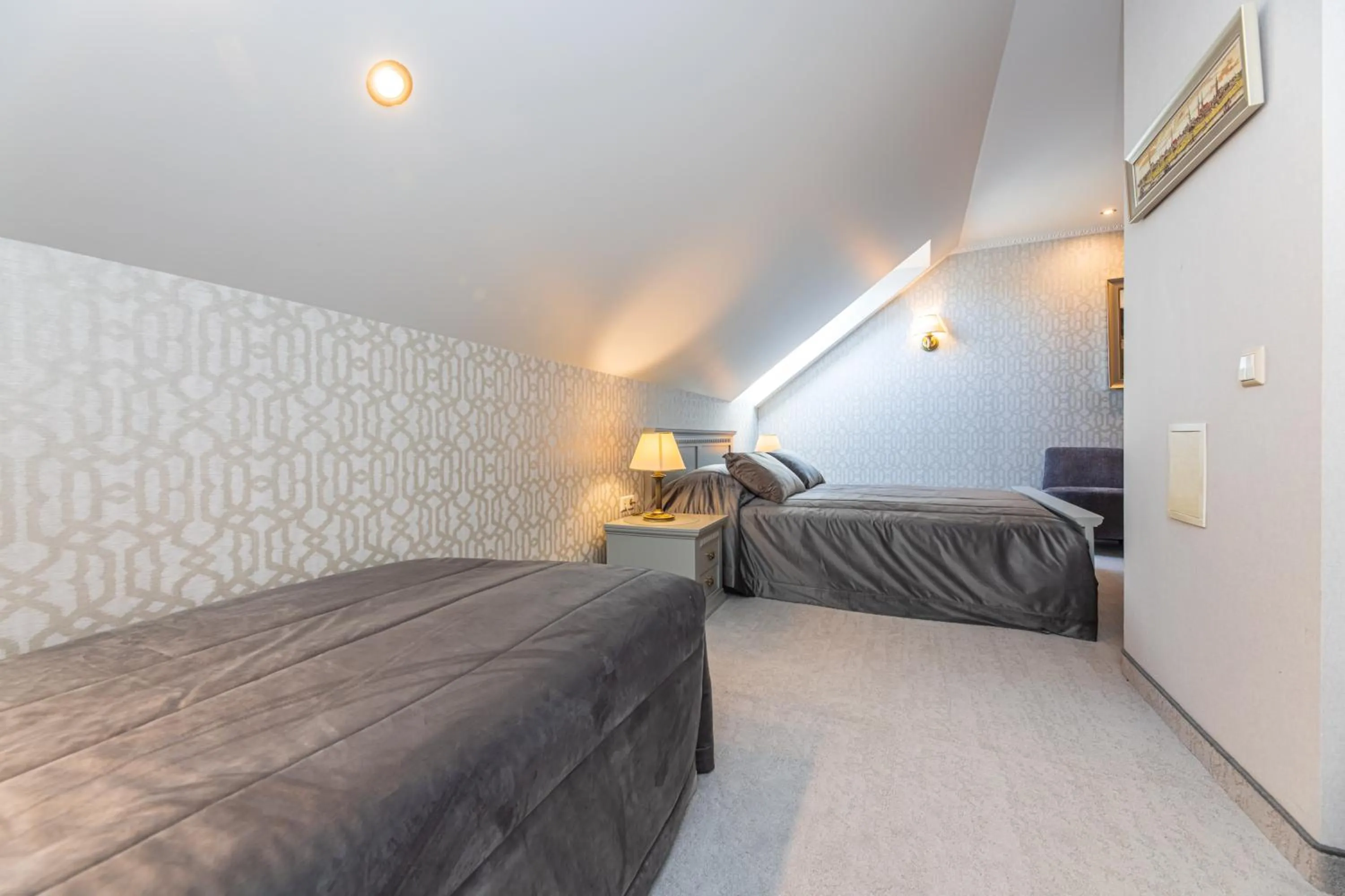 Bed in Senoji Hansa Hotel