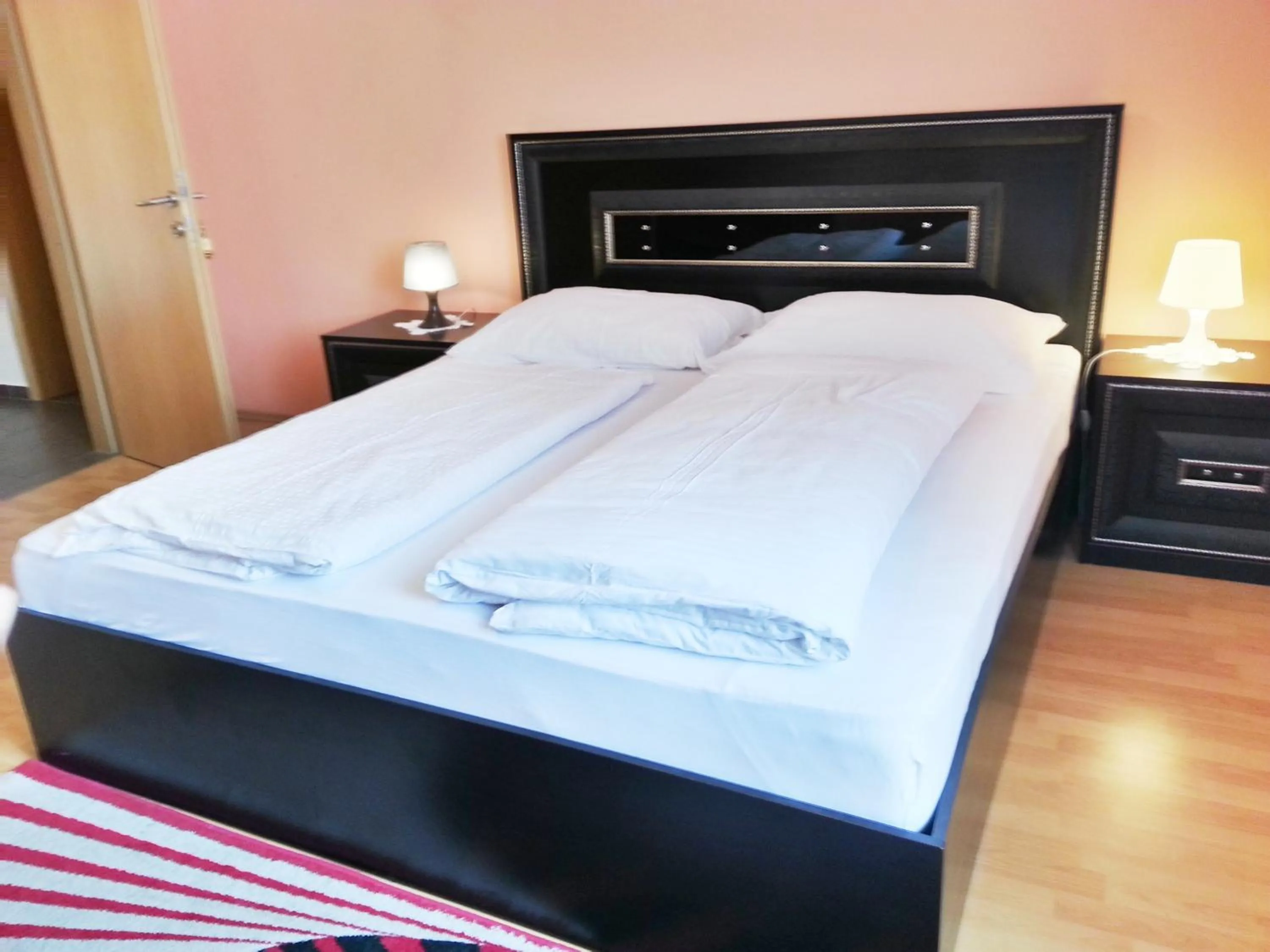 Bed in Pension Weisses Lamm