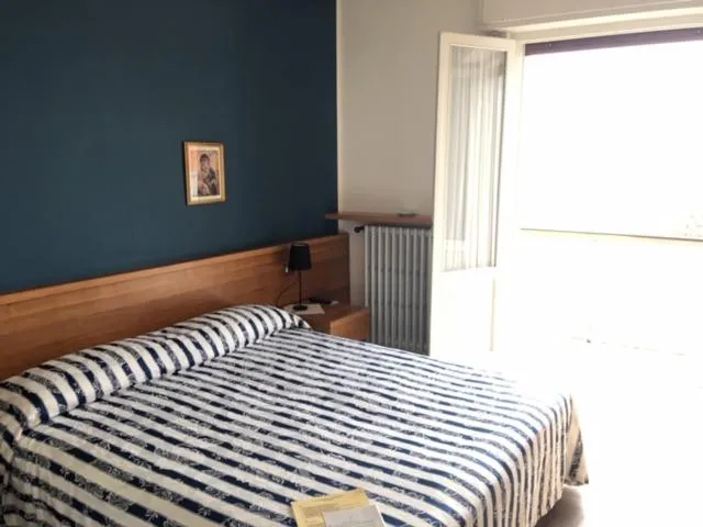 Bedroom in Belvedere Hotel & Villa