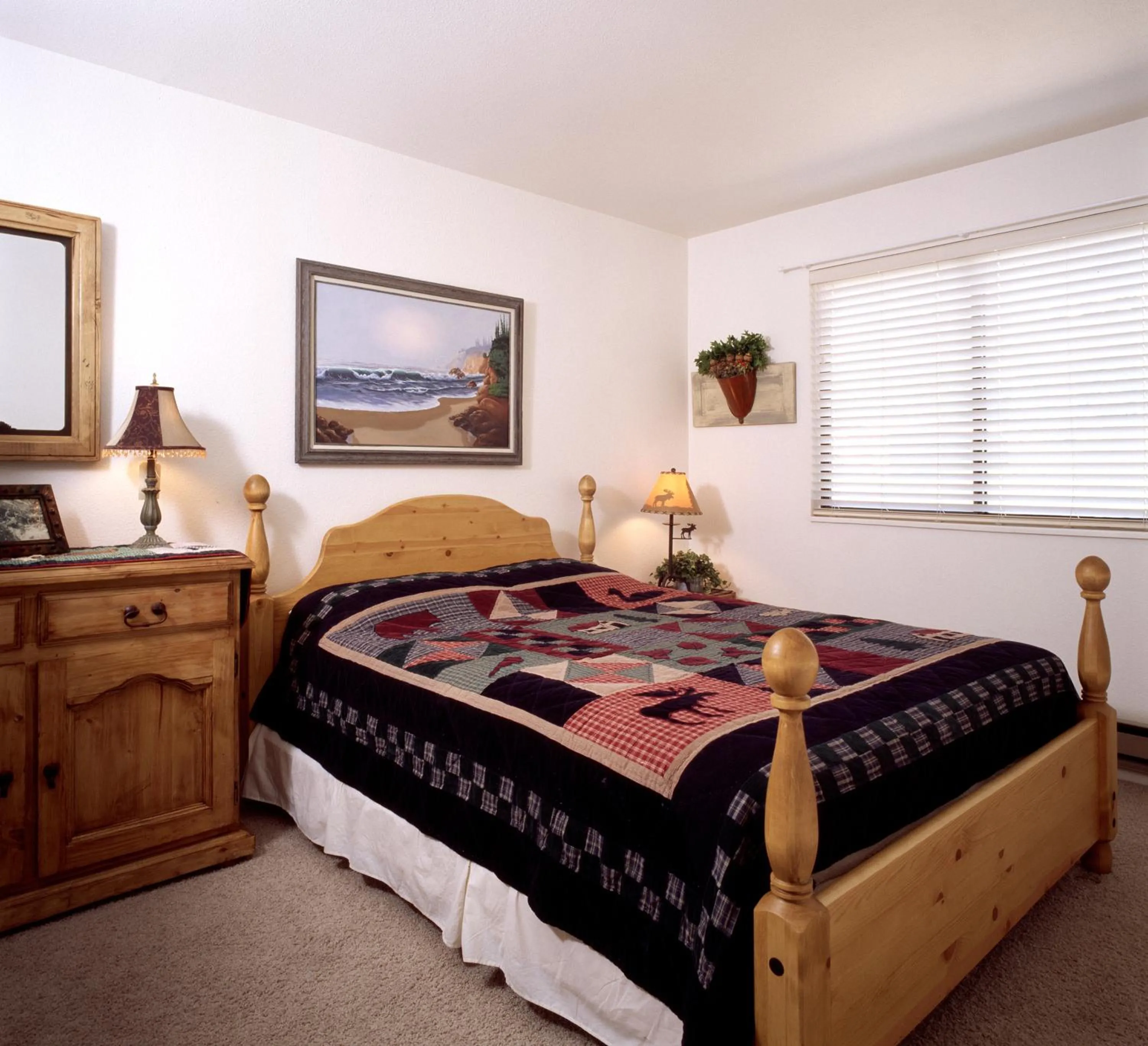 Bed in Red Pine Condominiums by All Seasons Resort Lodging