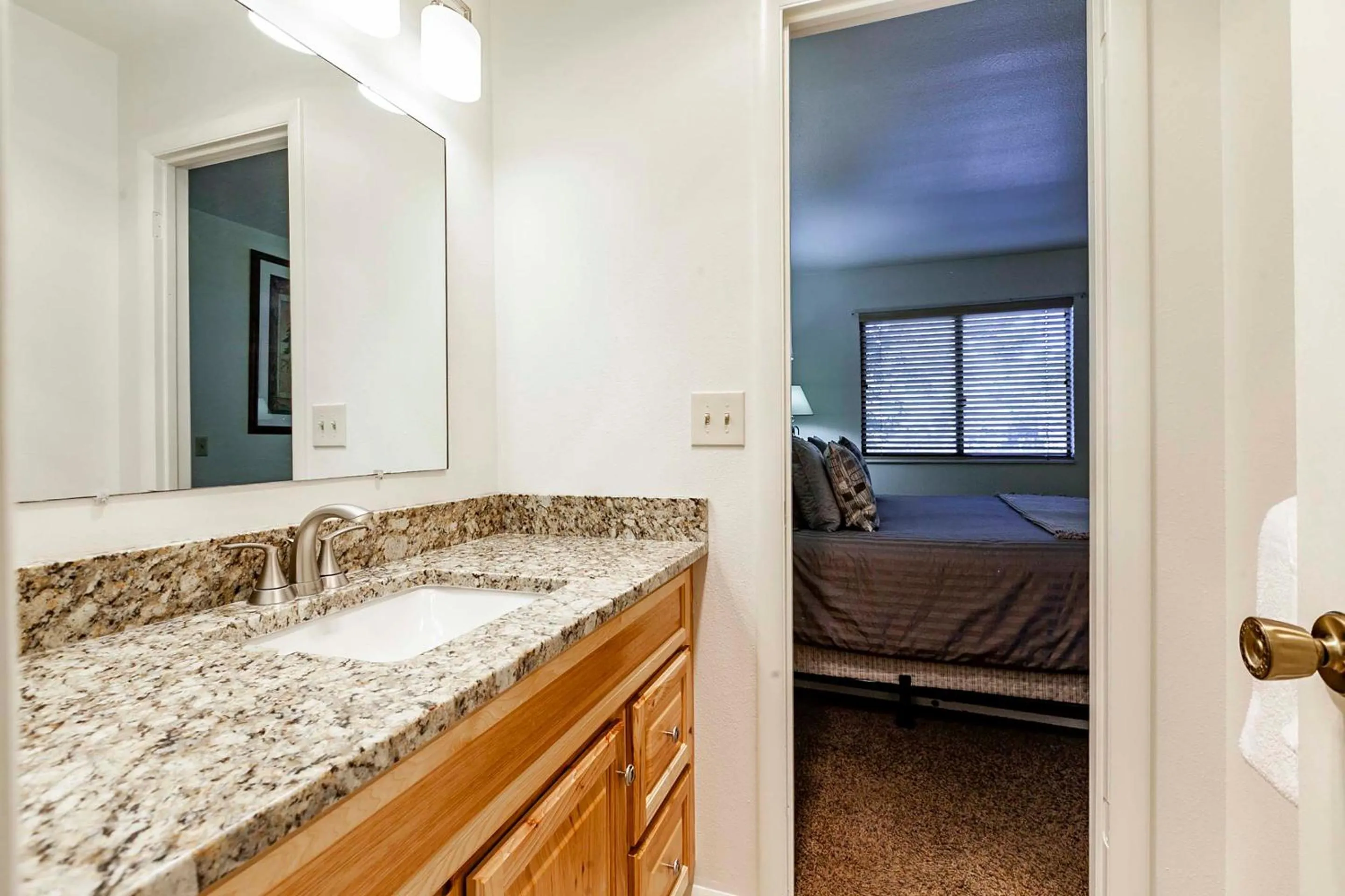 Bathroom, Bed in Red Pine Condominiums by All Seasons Resort Lodging