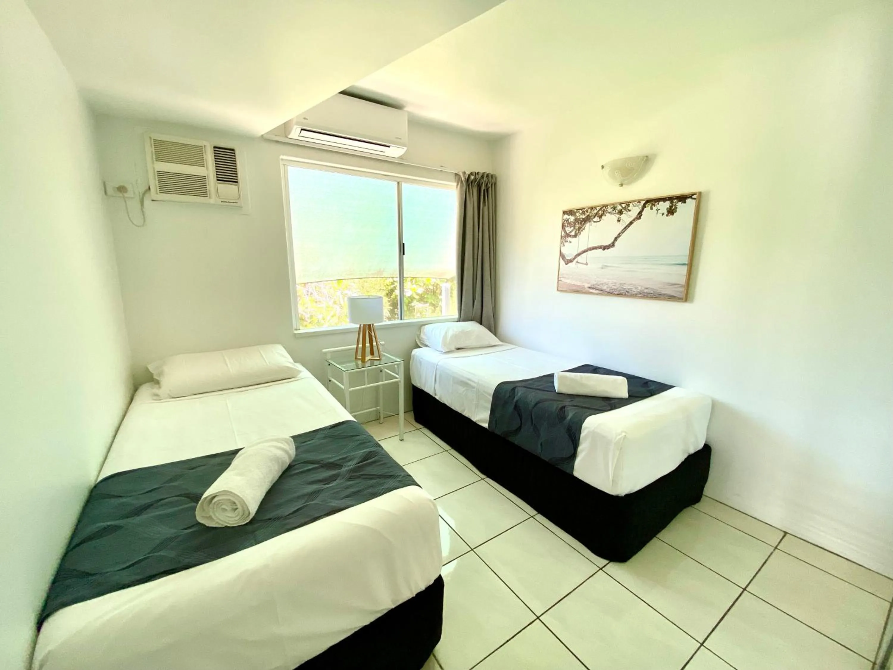 Bed in Reef Gateway Apartments