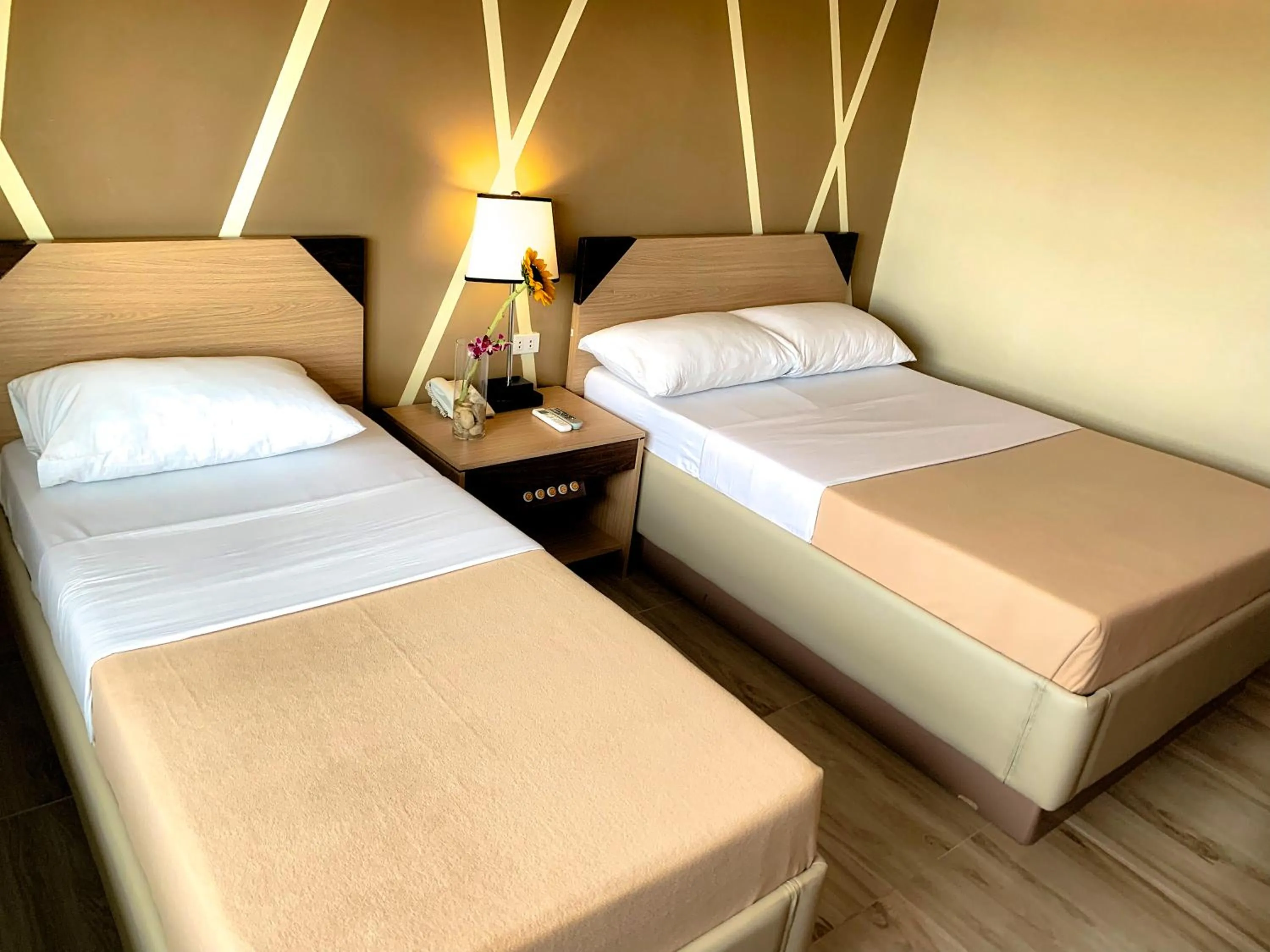 Bed in New Dawn Hotel Plus