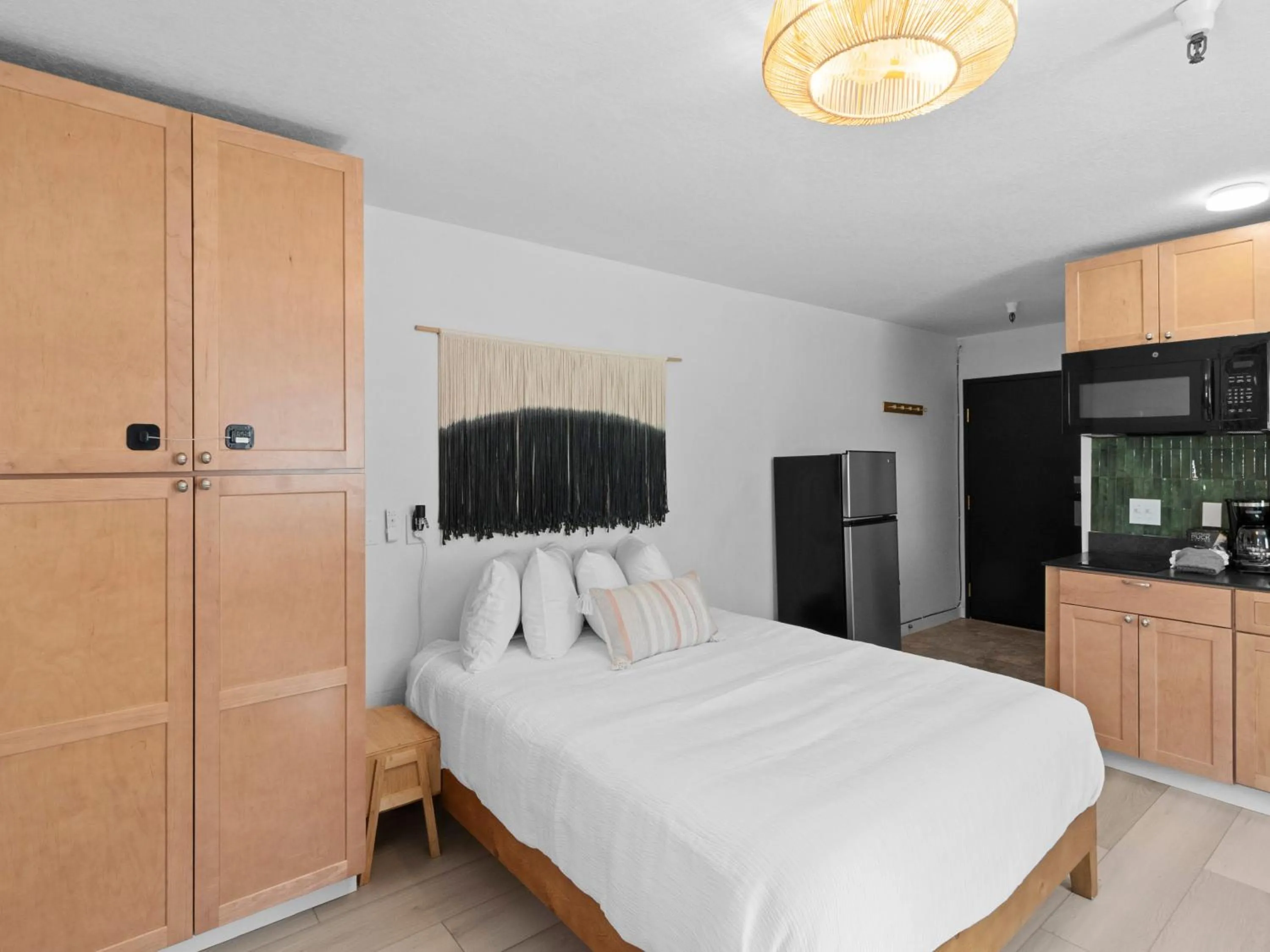 Bed in Carriage House Condominiums by All Seasons Resort Lodging