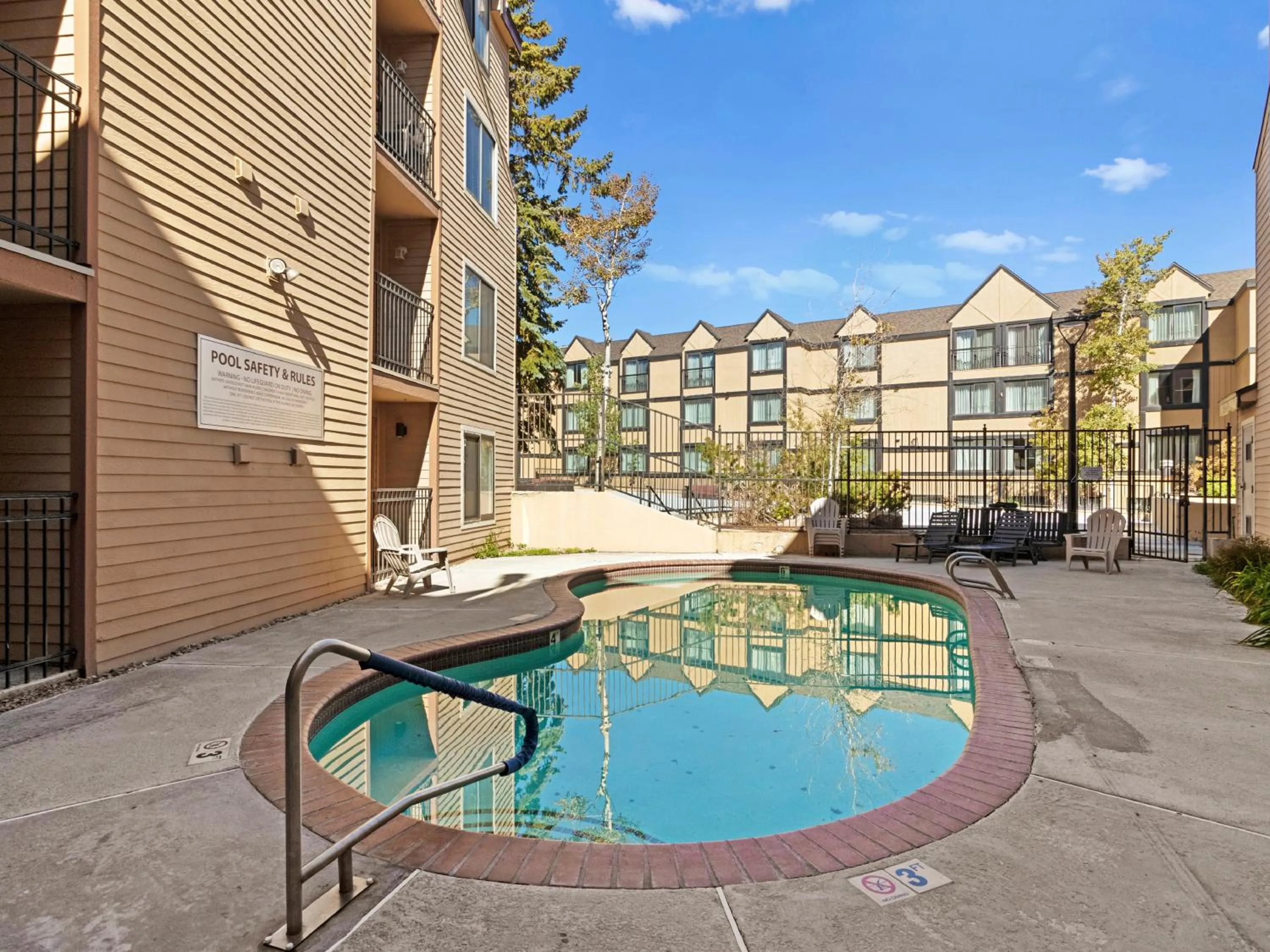 Pool view in Carriage House Condominiums by All Seasons Resort Lodging