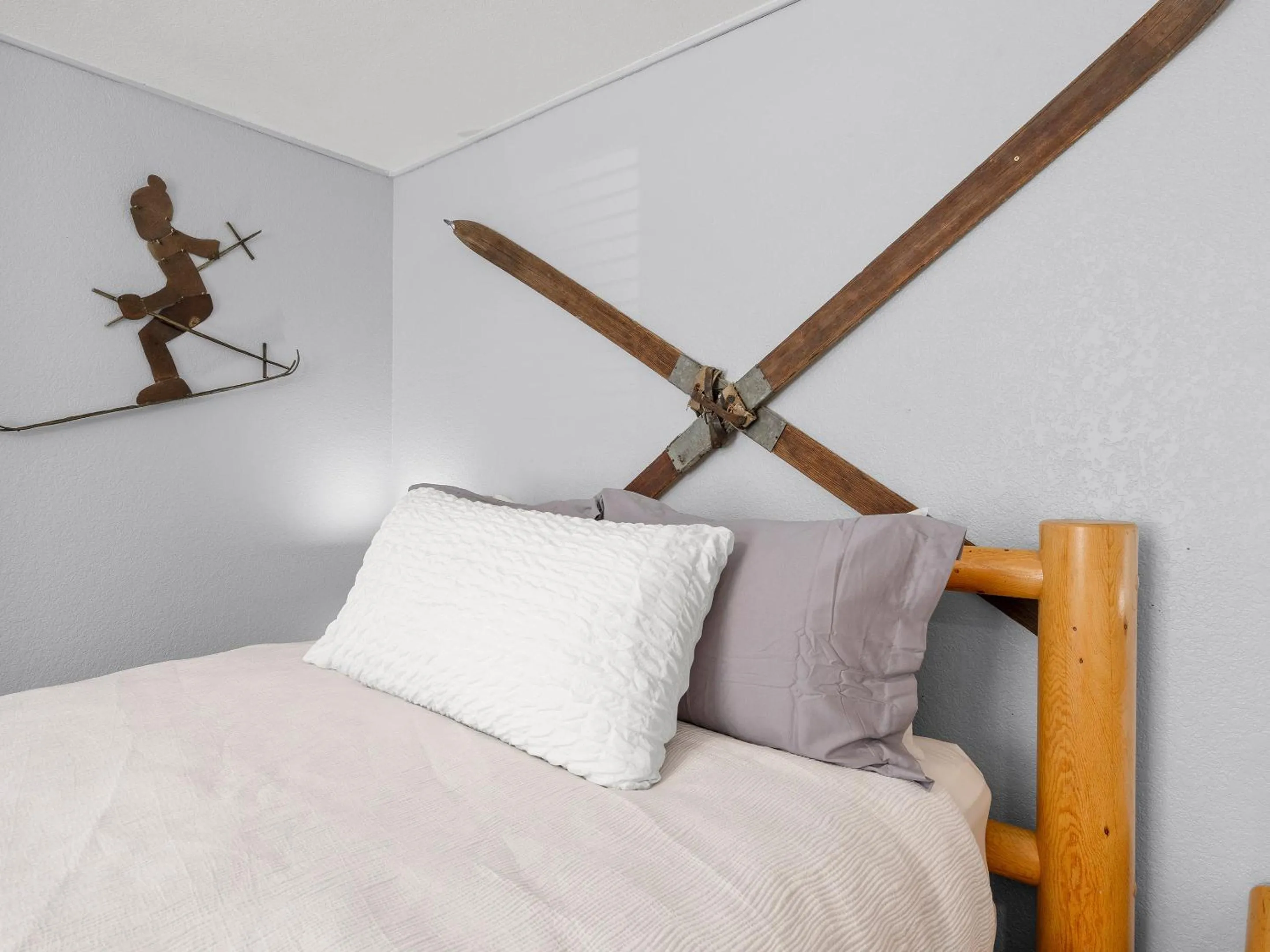 Bed in Carriage House Condominiums by All Seasons Resort Lodging