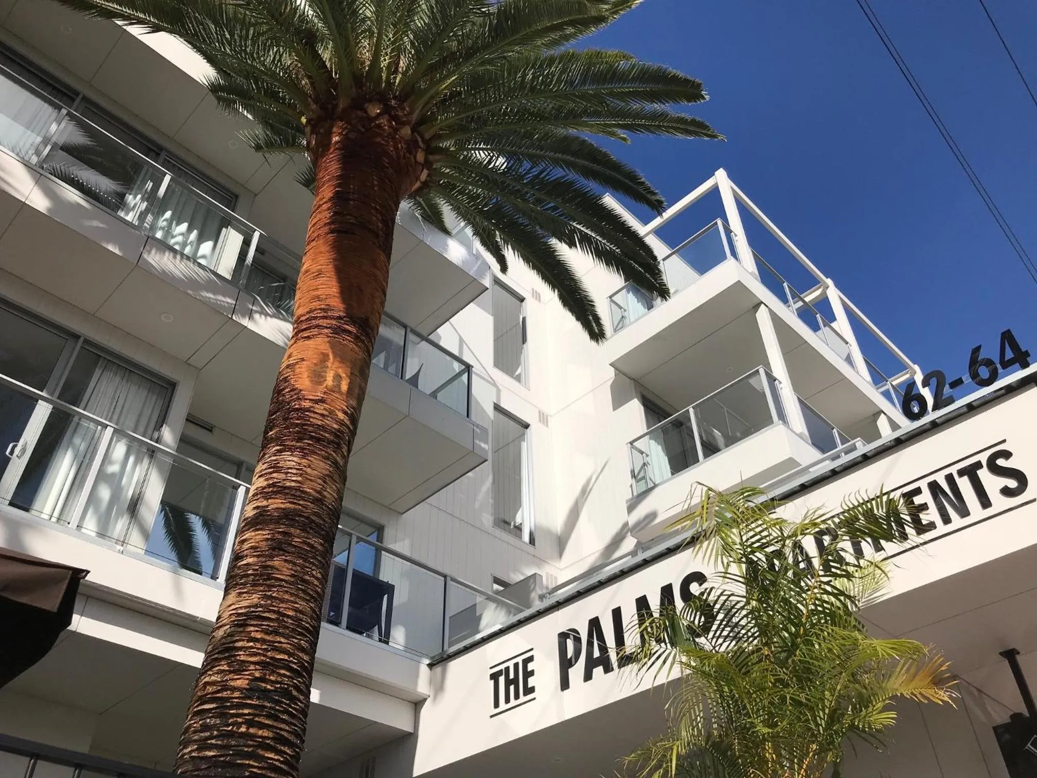 Facade/entrance in The Palms Apartments