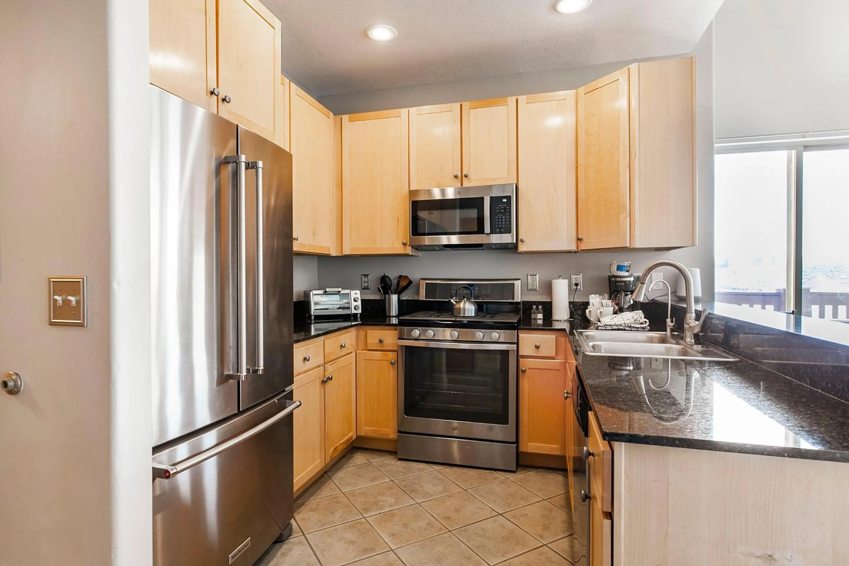 kitchen in Crestview Condominiums by All Seasons Resort Lodging