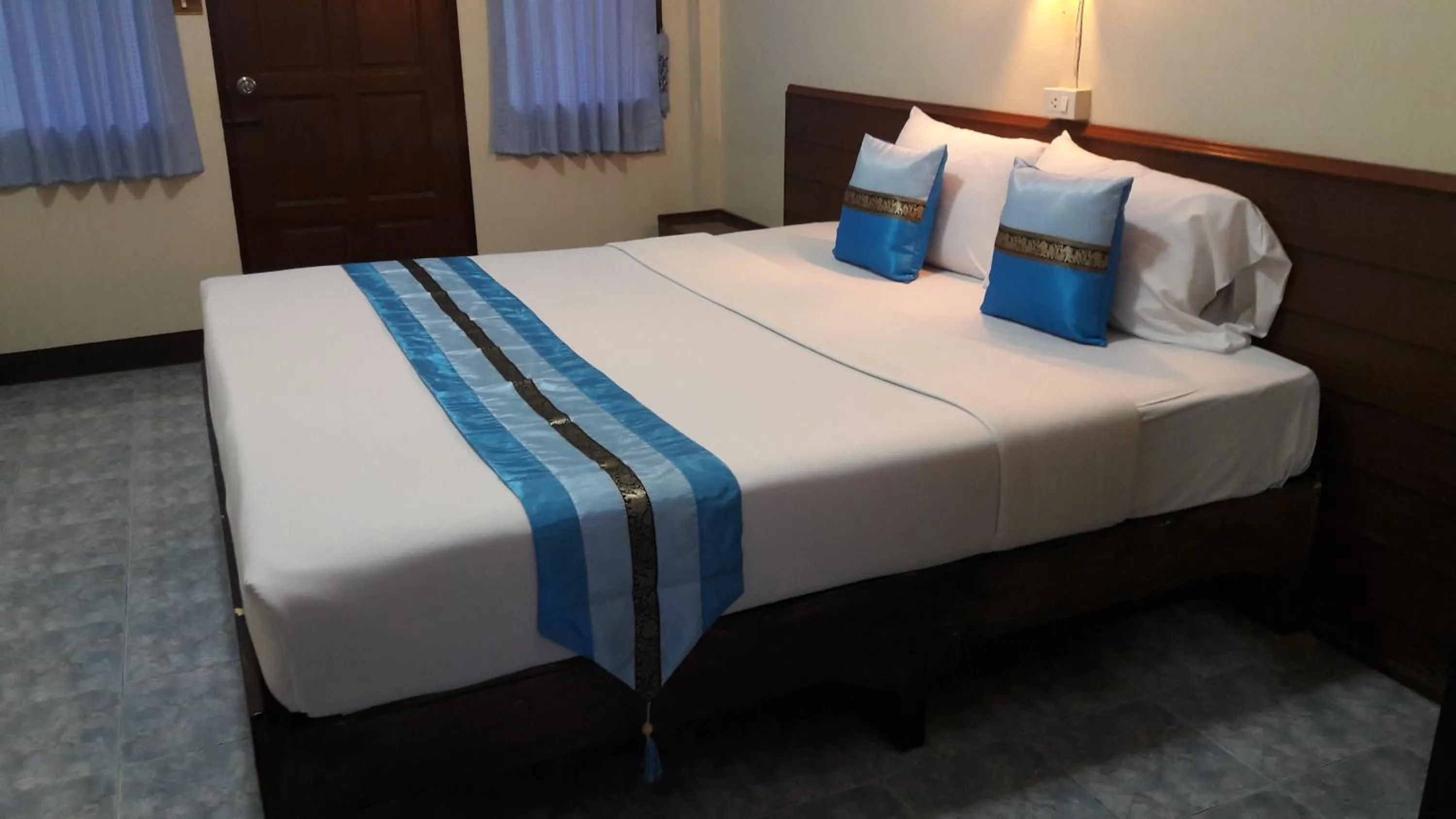 Bed in Lanna Thai Guesthouse