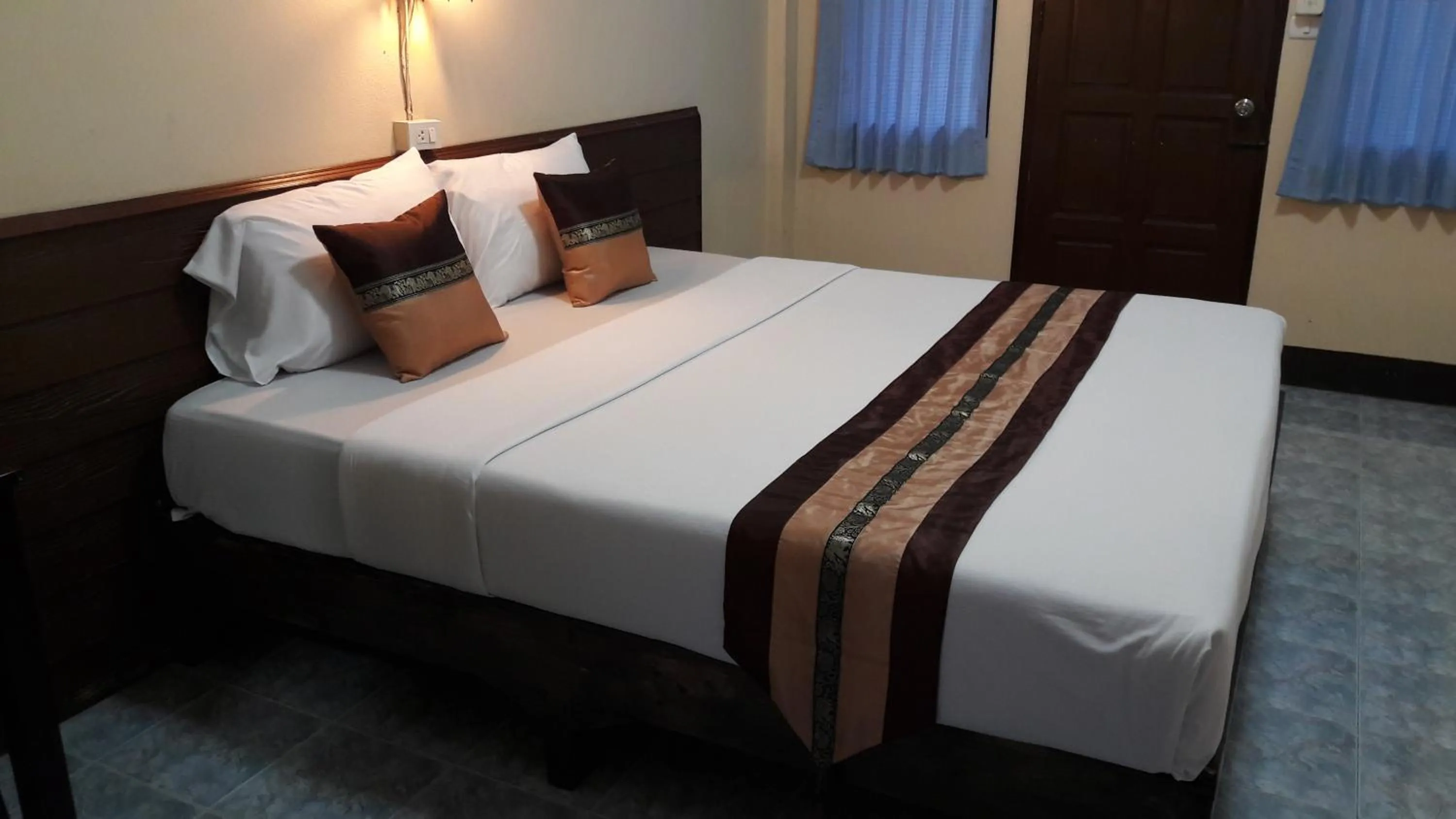 Bed in Lanna Thai Guesthouse