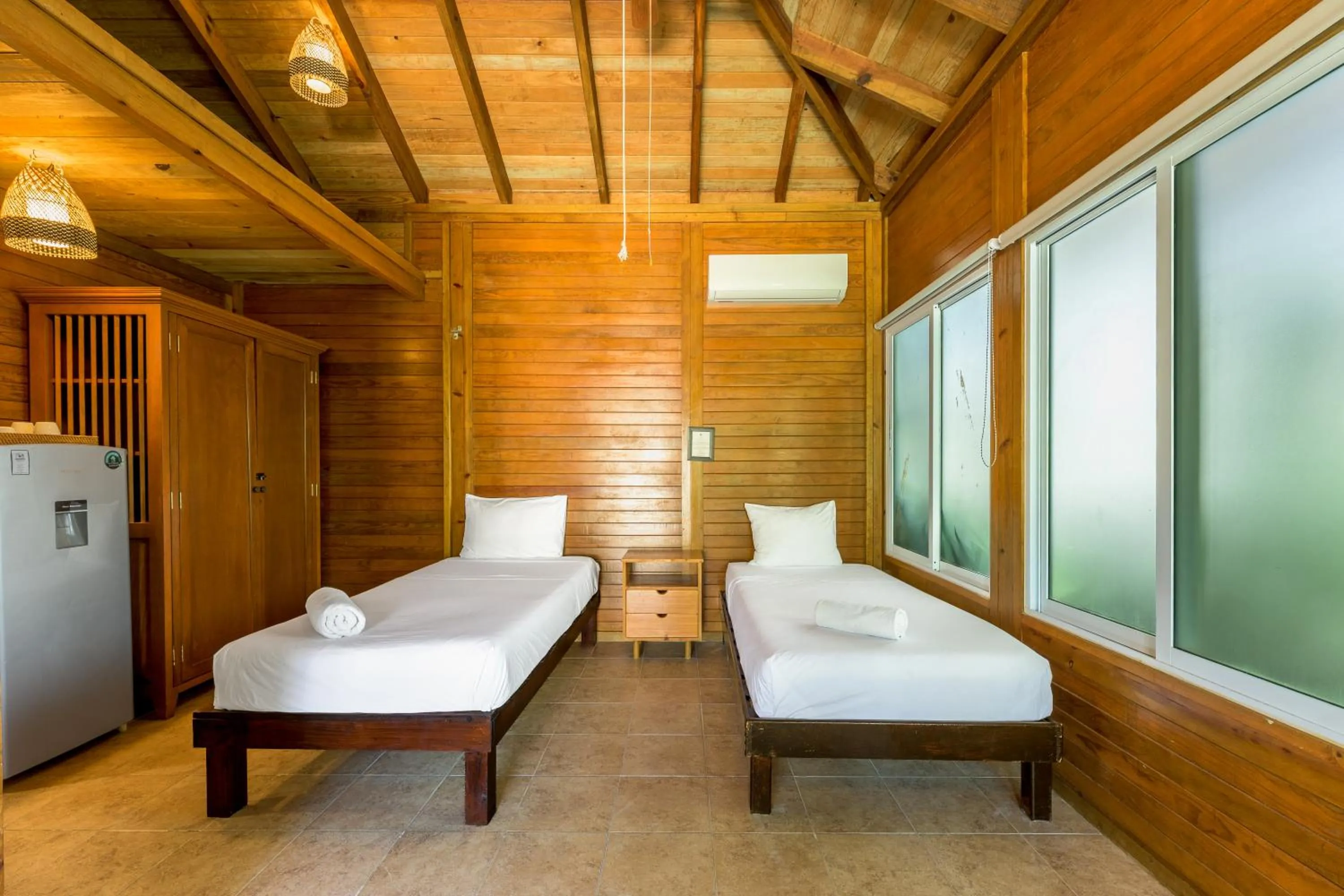 Bed in Tekio Beach Hotel