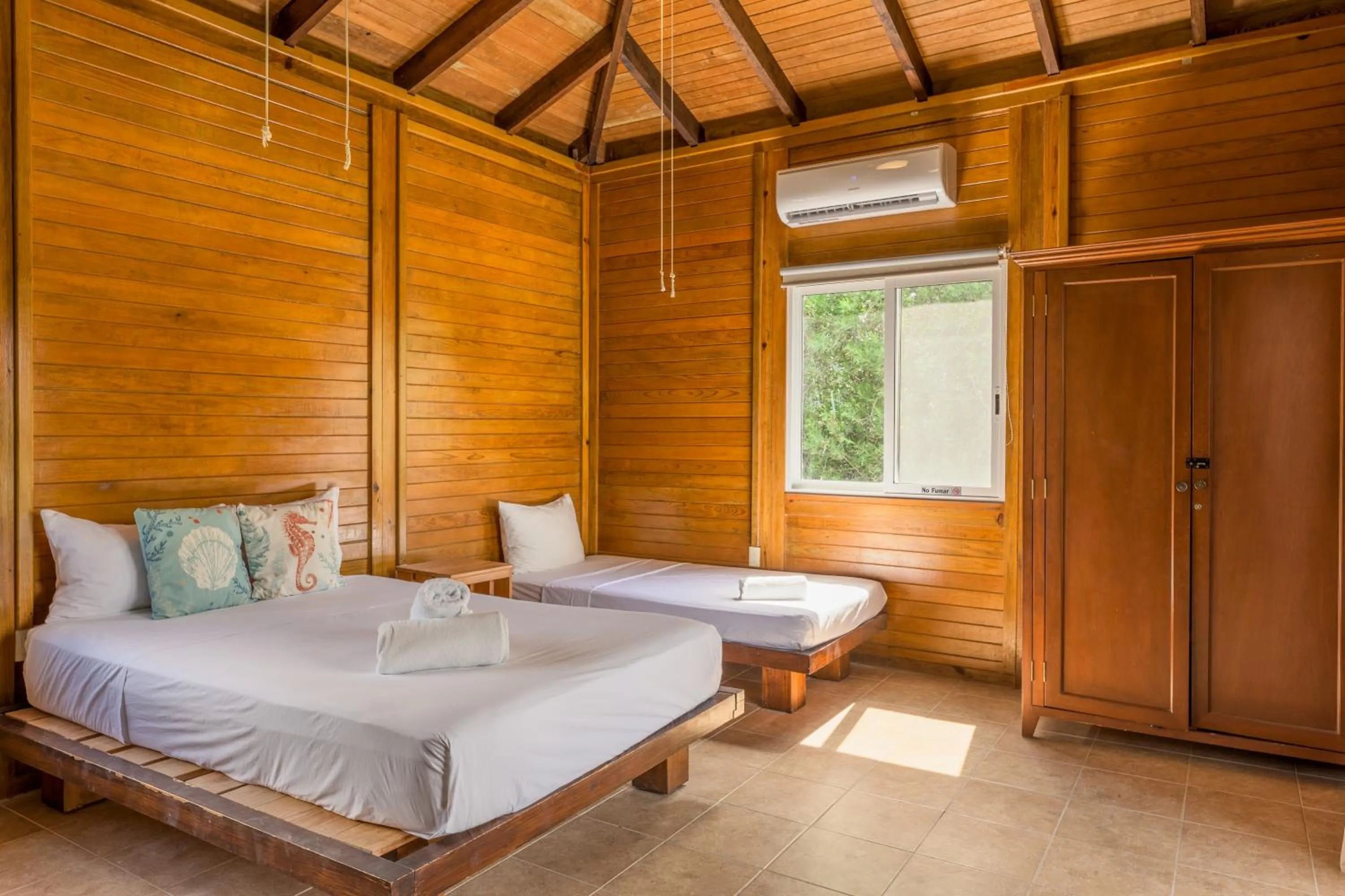 Bed in Tekio Beach Hotel