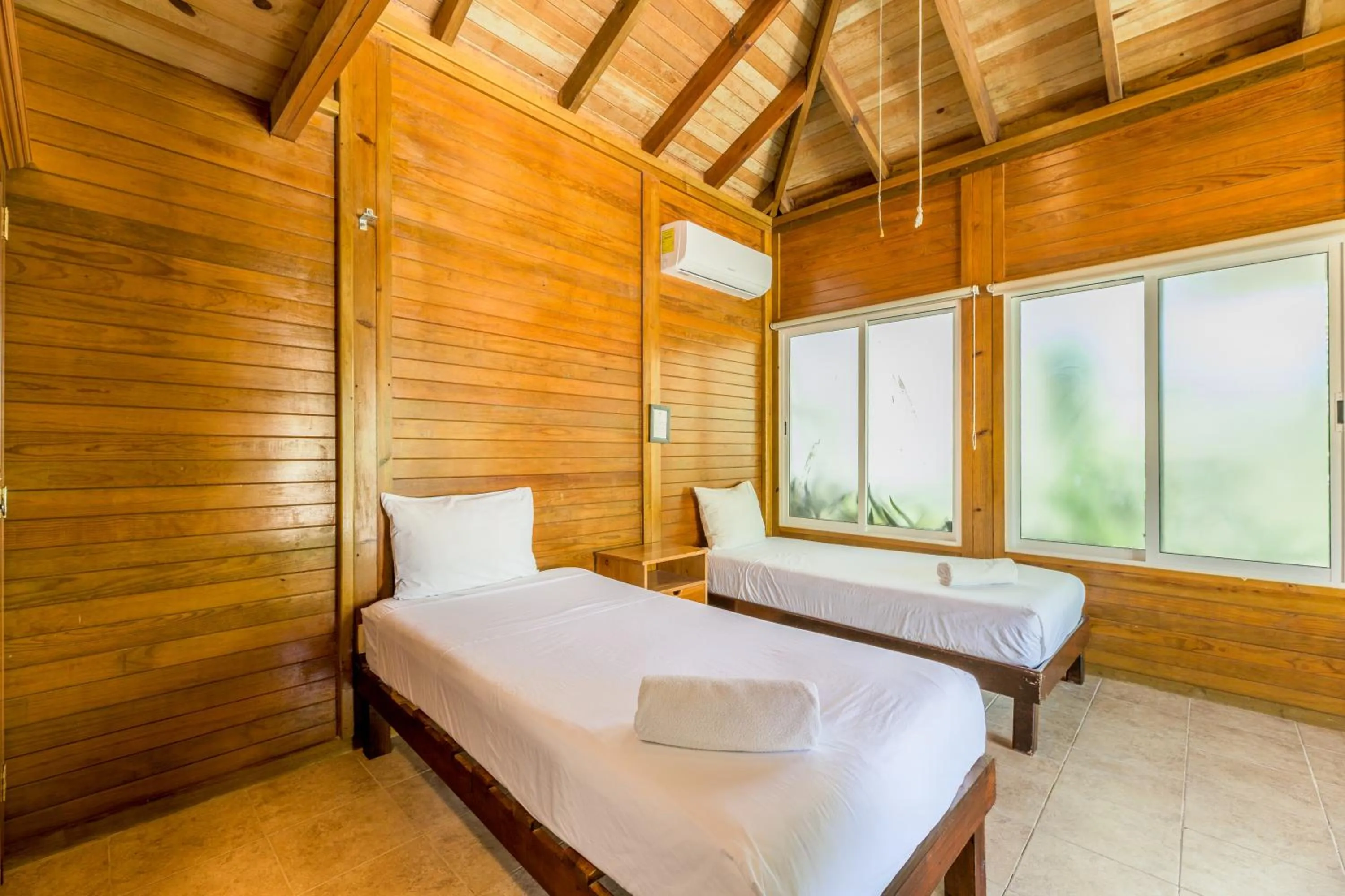 Bed in Tekio Beach Hotel