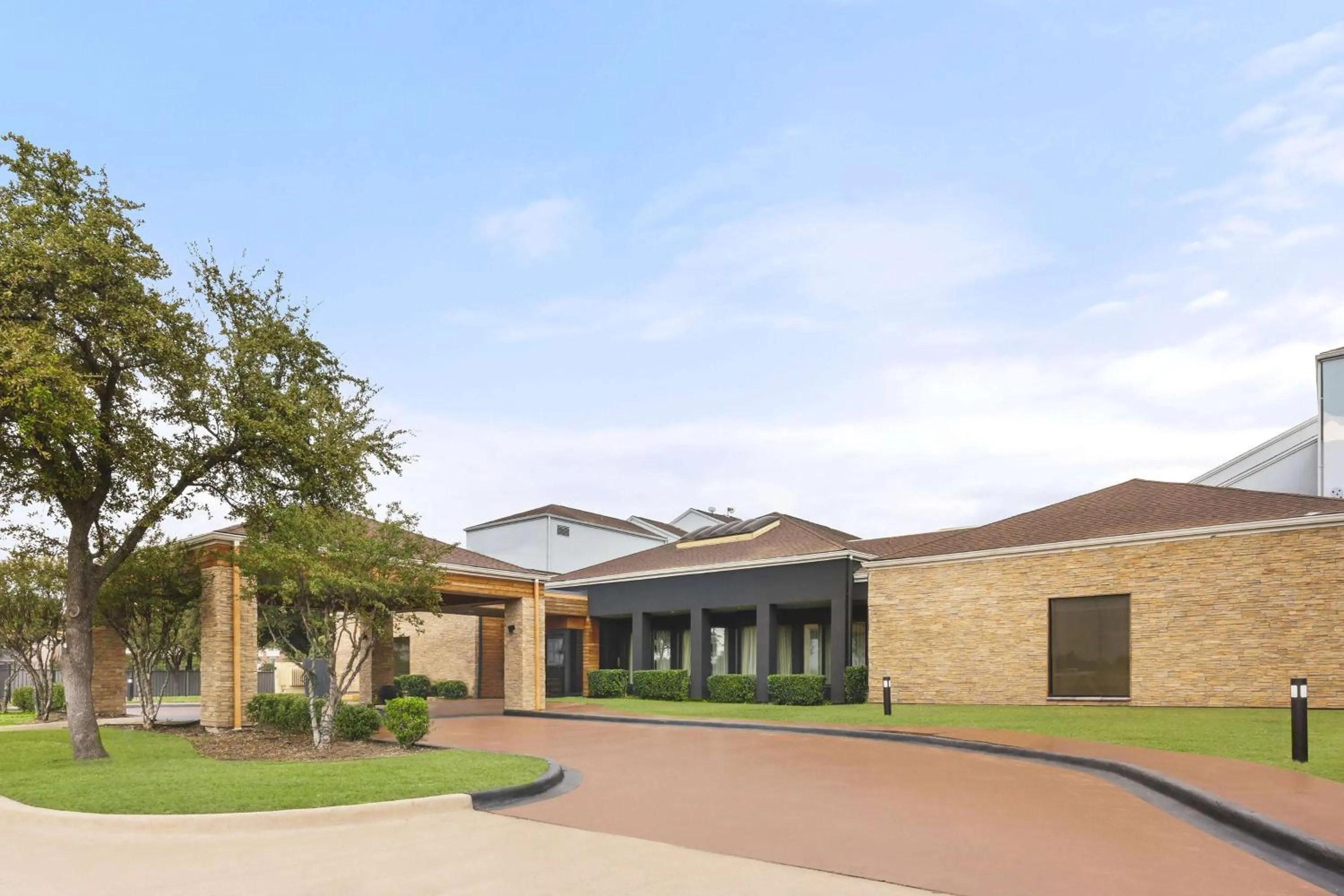 Property building in Super 8 by Wyndham Dallas Love Field Airport