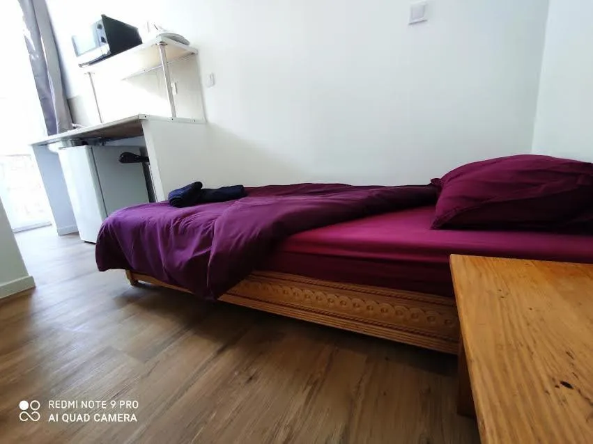 Bed in Hôtel Lyonnais