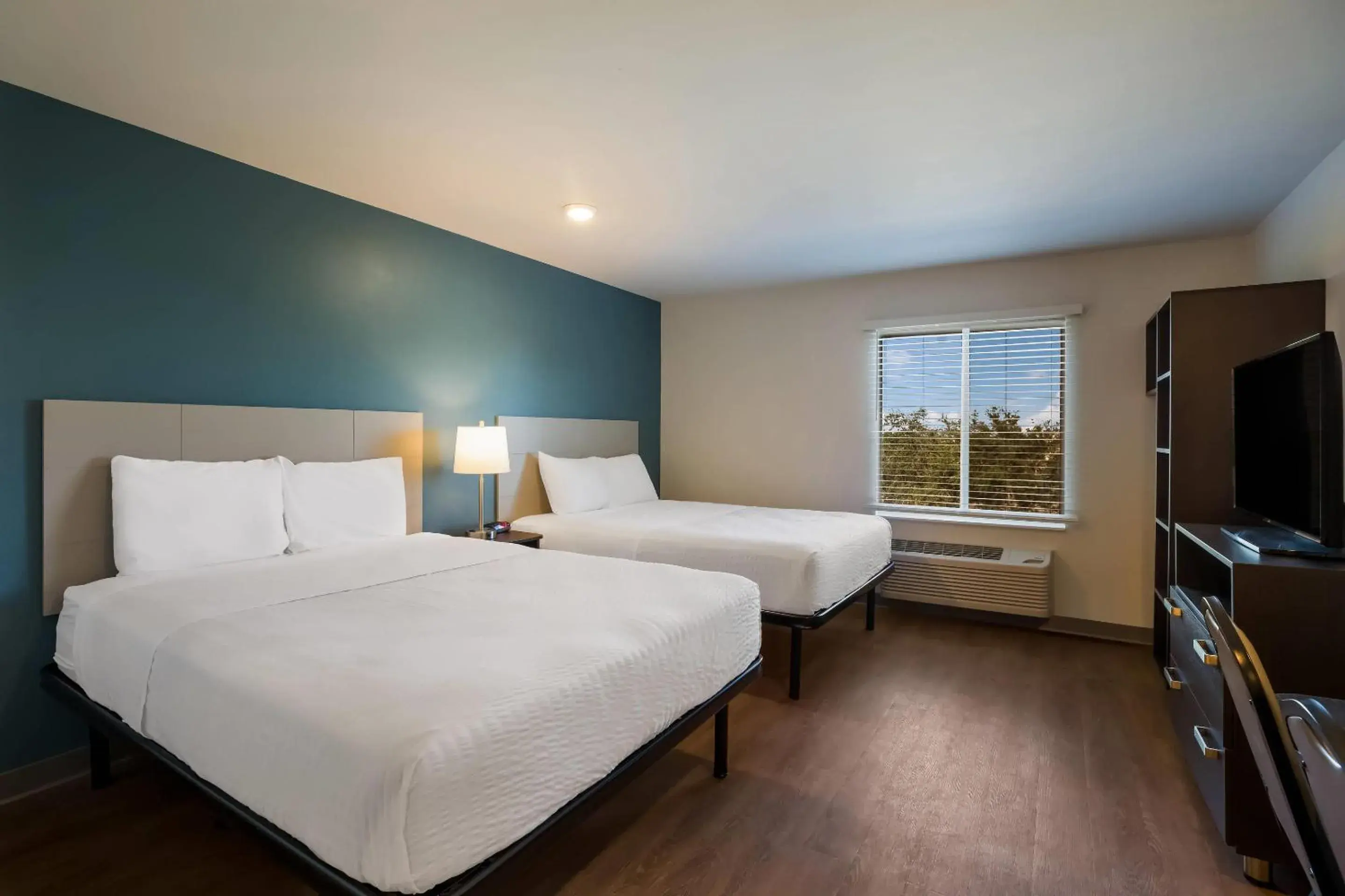 Bedroom, Bed in WoodSpring Suites Orlando West - Clermont Bedroom, Bed in WoodSpring Suites Orlando West - Clermont