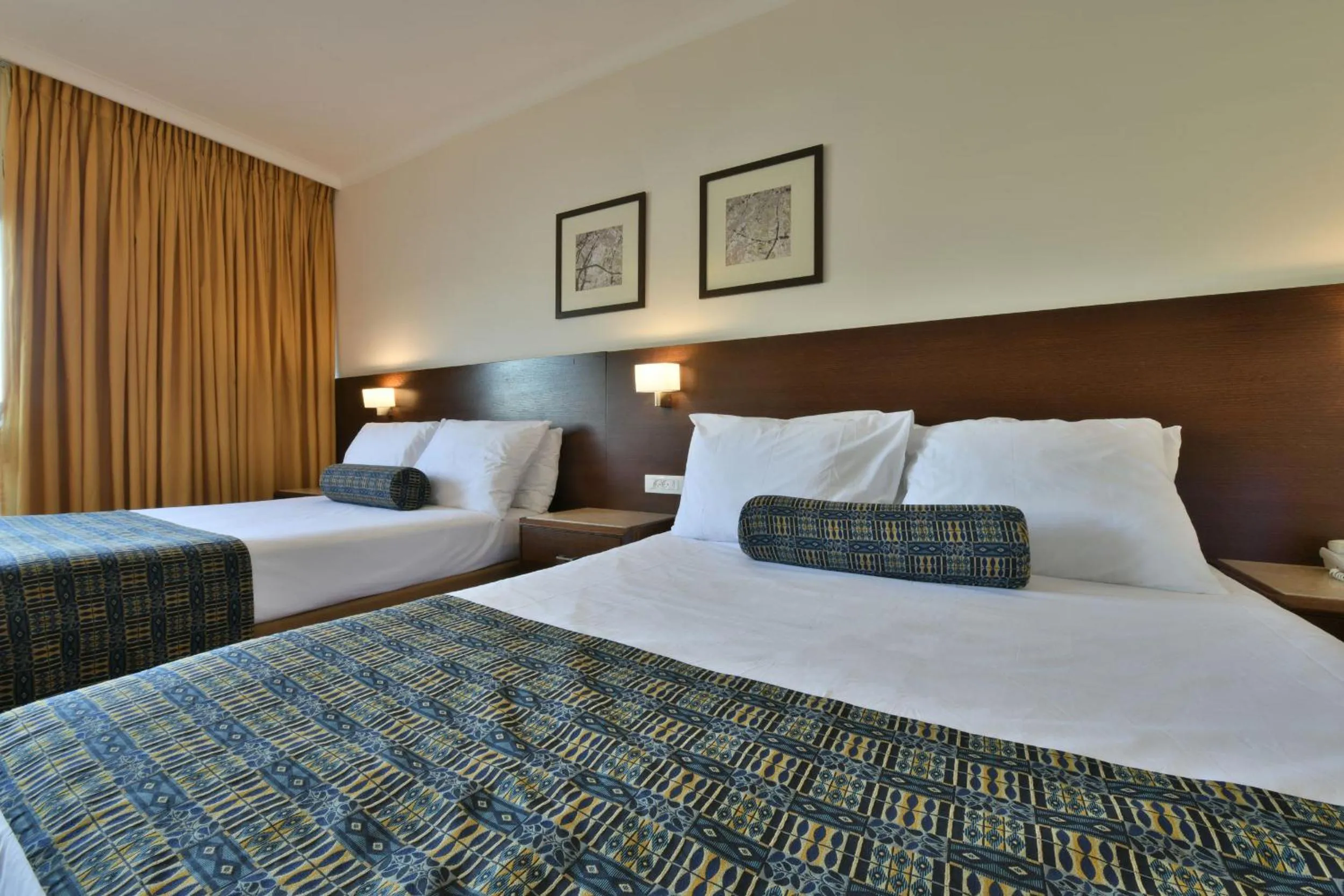 Bed in Caesar Premier Eilat Hotel