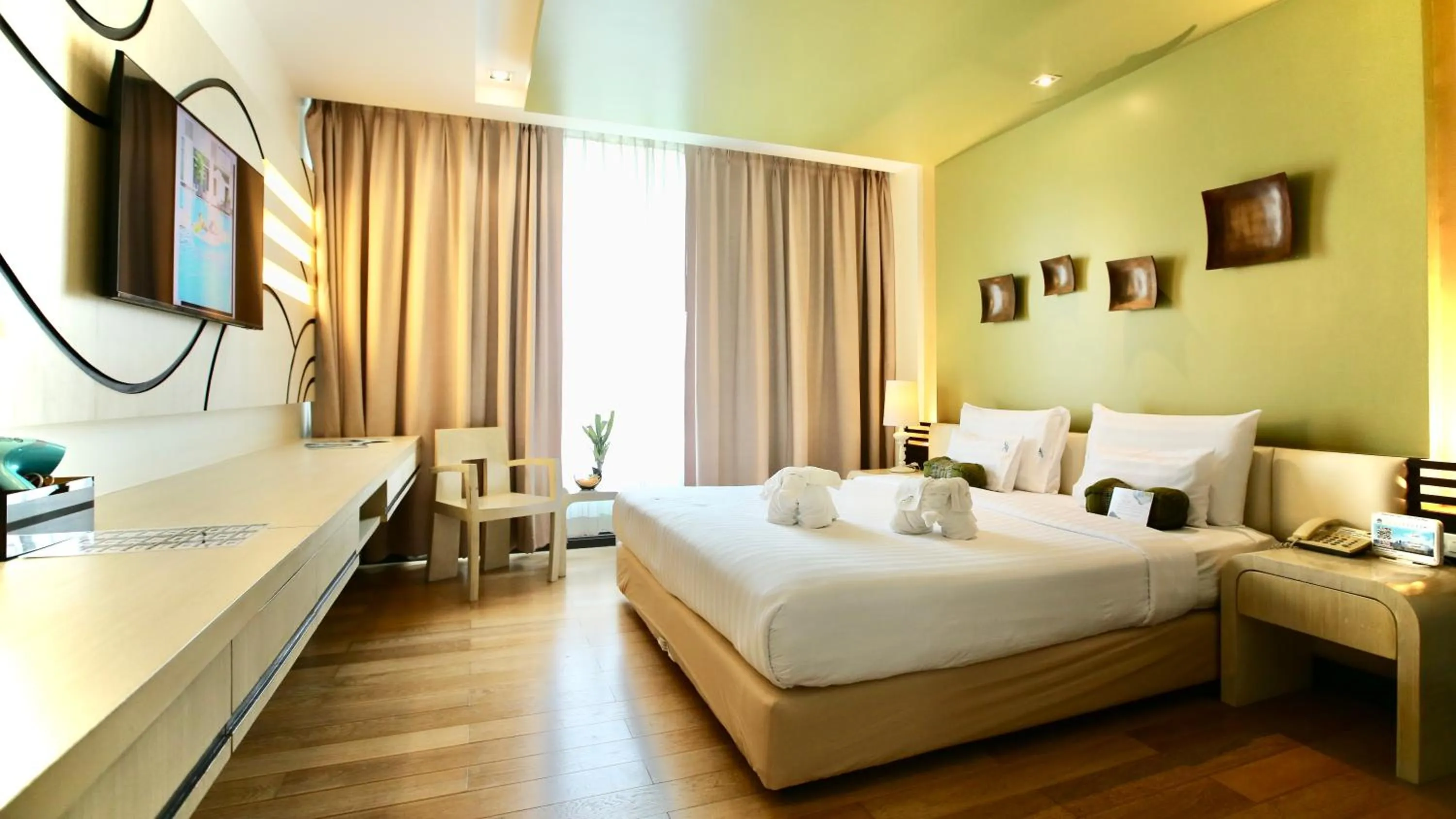 Photo of the whole room, Bed in A-Te Chumphon Hotel - SHA Plus