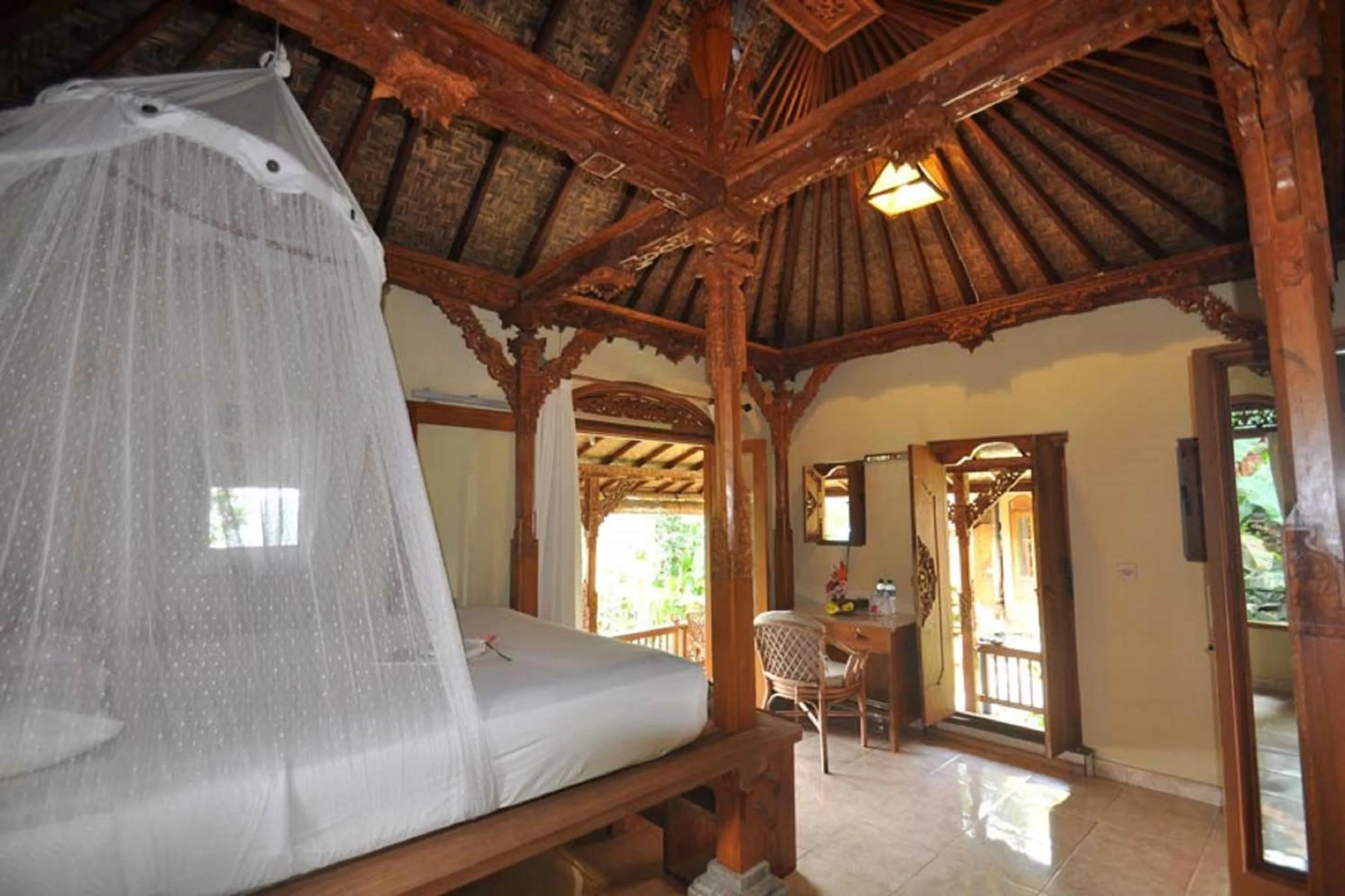 Bed in Puri Lumbung Cottages Restaurant & Spa Munduk