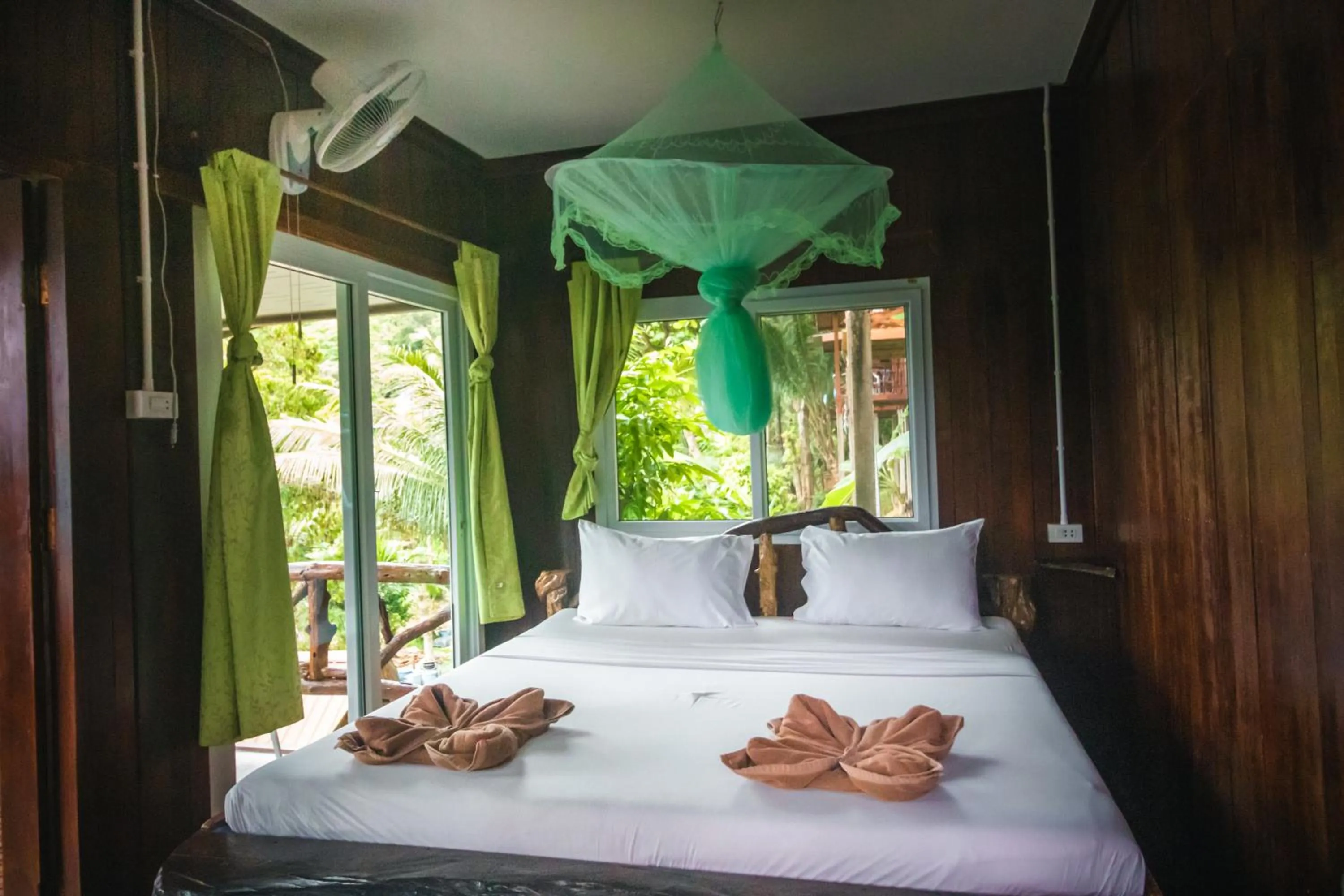 Bed in Phi Phi Sunset Bay Resort