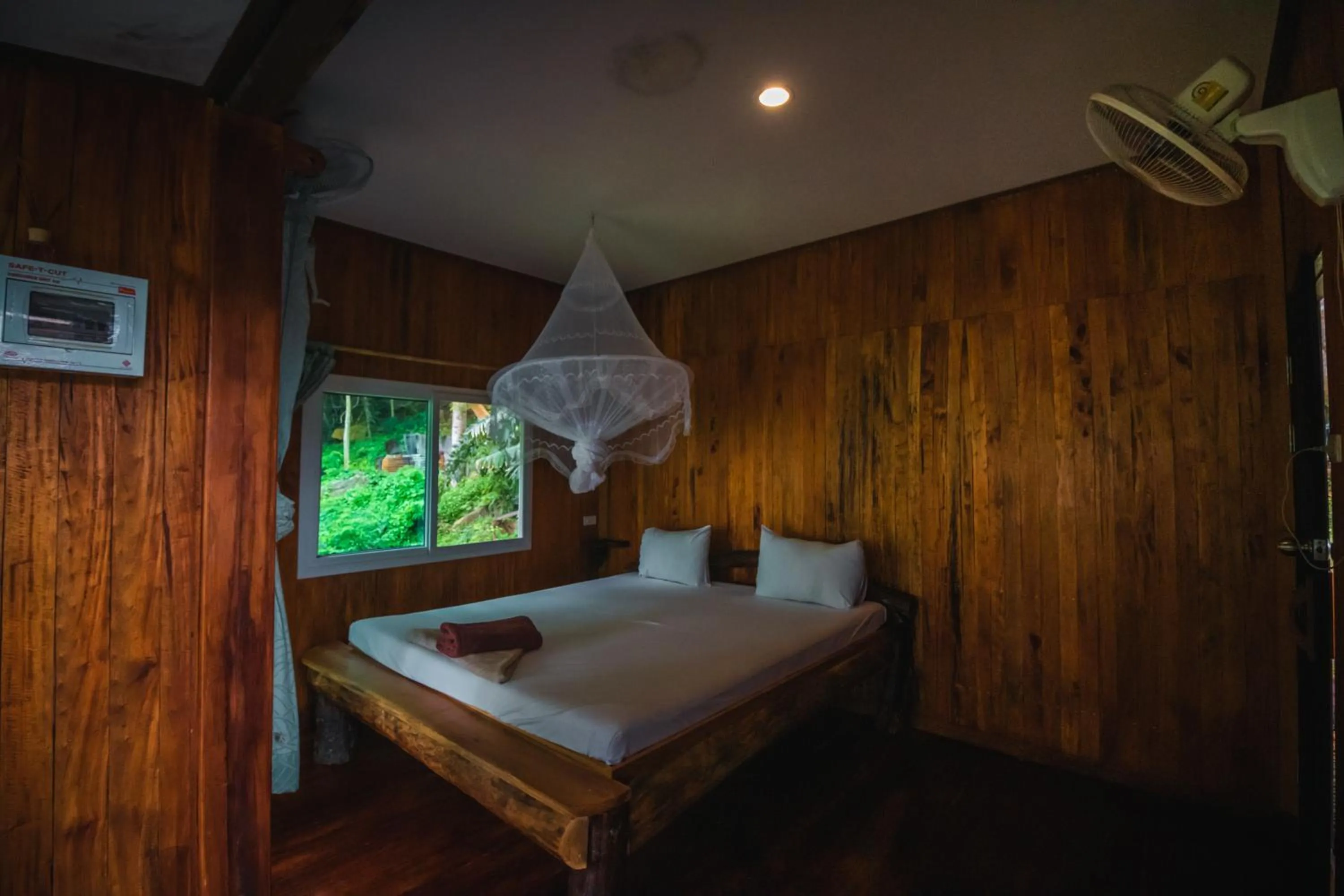 Bed in Phi Phi Sunset Bay Resort