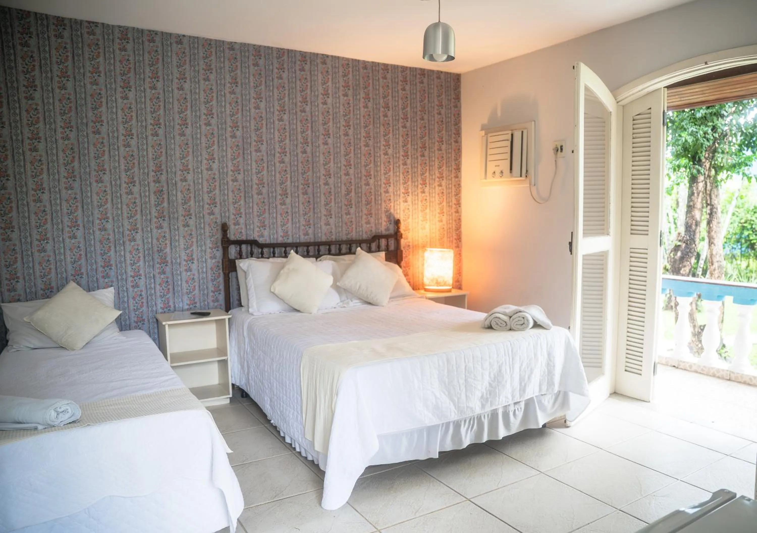 Bed in Pousada Flor de Penedo