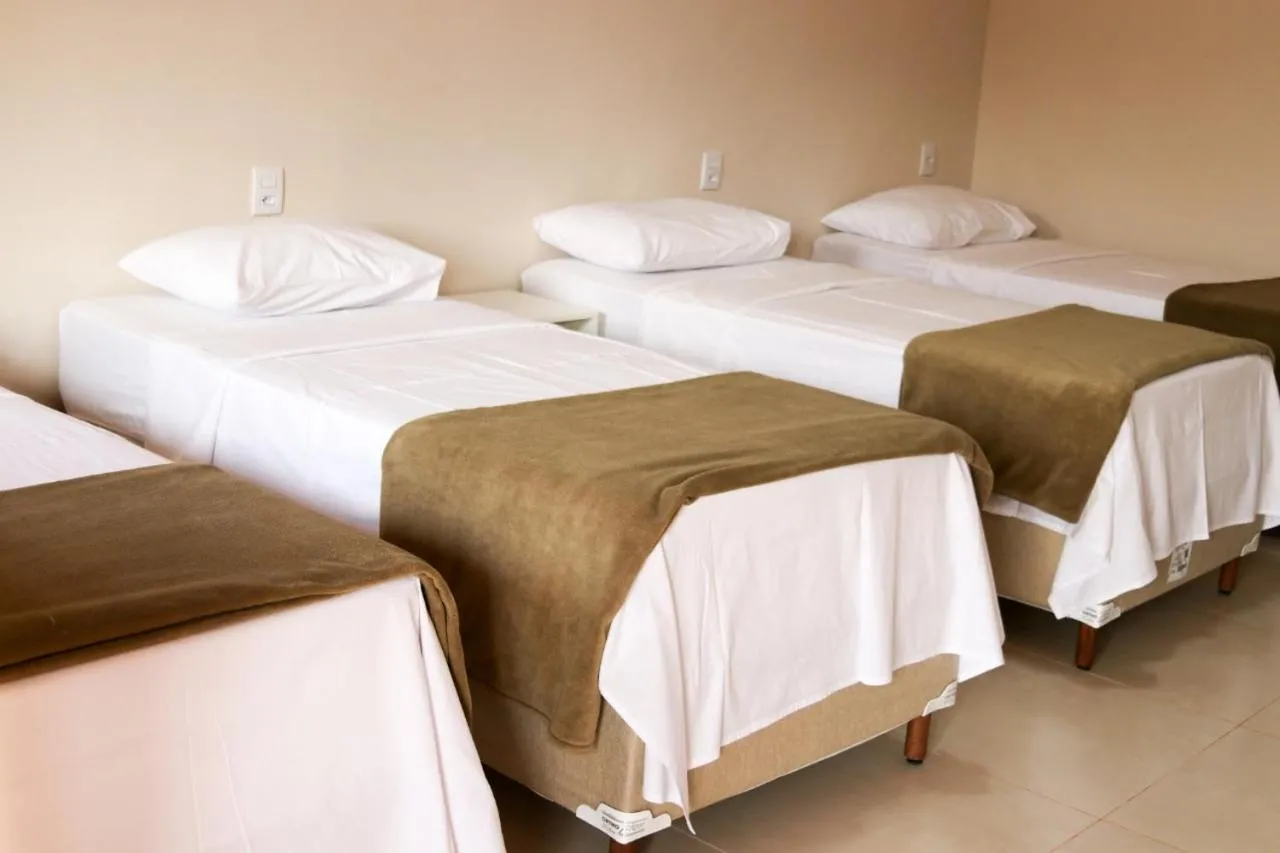 Bed in Chalés Cantinho da Roça