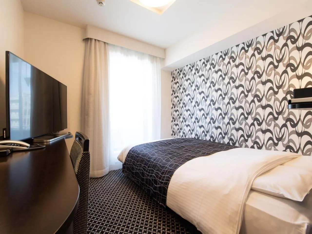 Bed in APA Hotel TKP Tokyo Nishi-Kasai