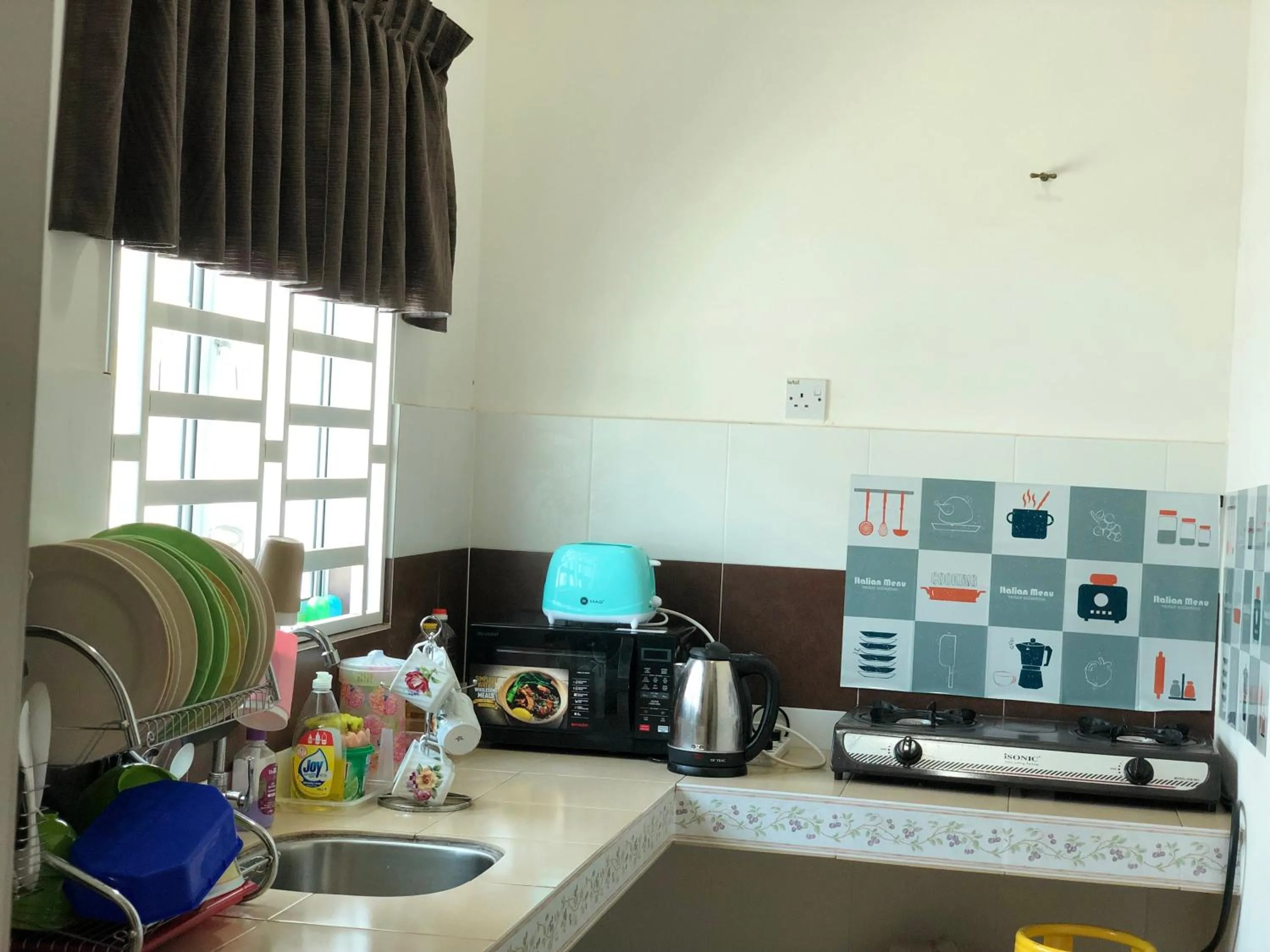 Kitchen or kitchenette in Homestay Cahaya 1 Seri Iskandar