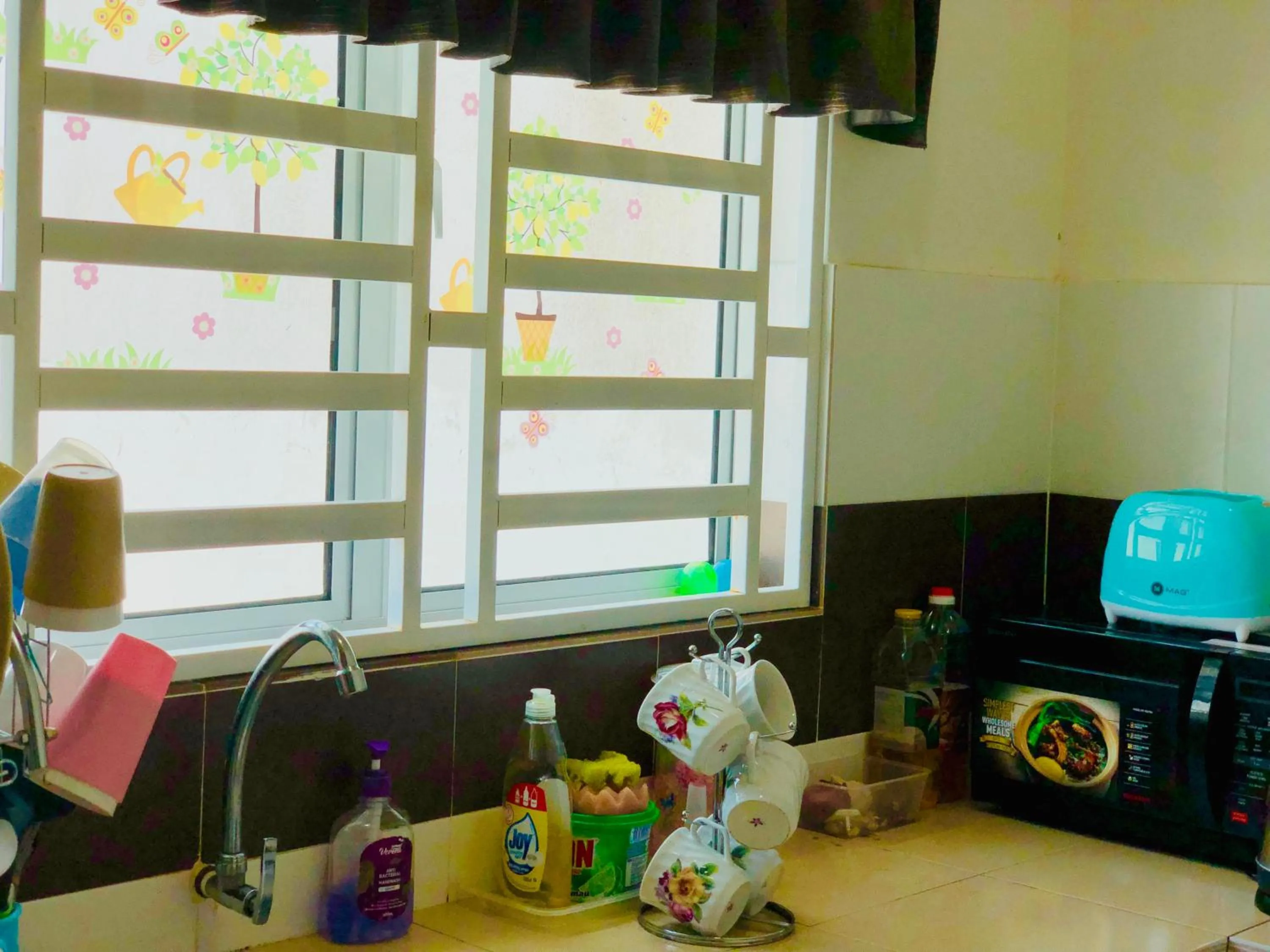 Kitchen or kitchenette in Homestay Cahaya 1 Seri Iskandar