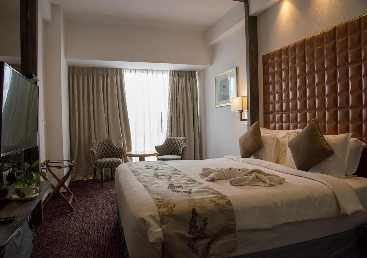 Bedroom, Bed in Regenta Central Hotel & Convention Centre Nagpur