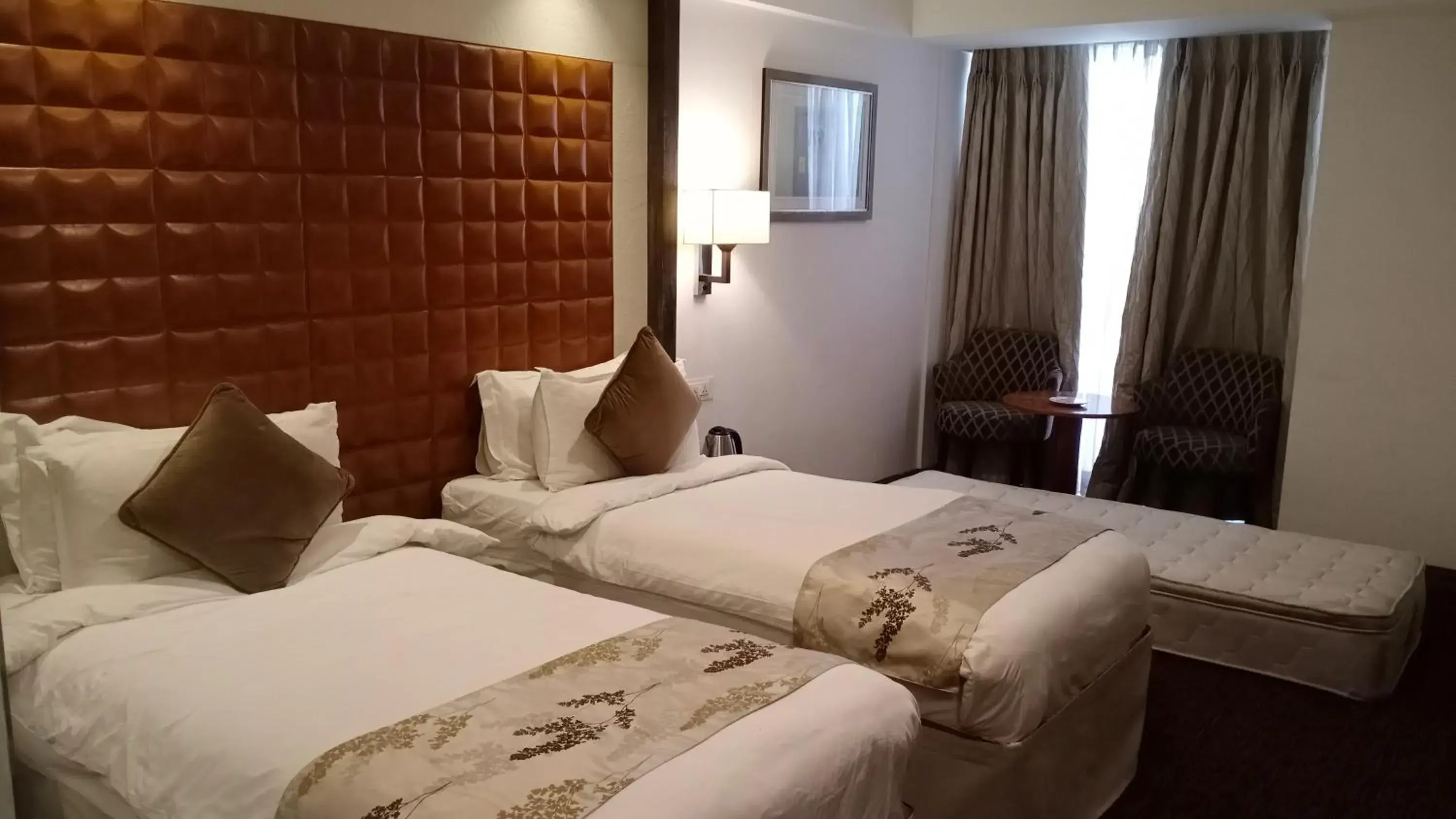 Bedroom, Bed in Regenta Central Hotel & Convention Centre Nagpur Bedroom, Bed in Regenta Central Hotel & Convention Centre Nagpur