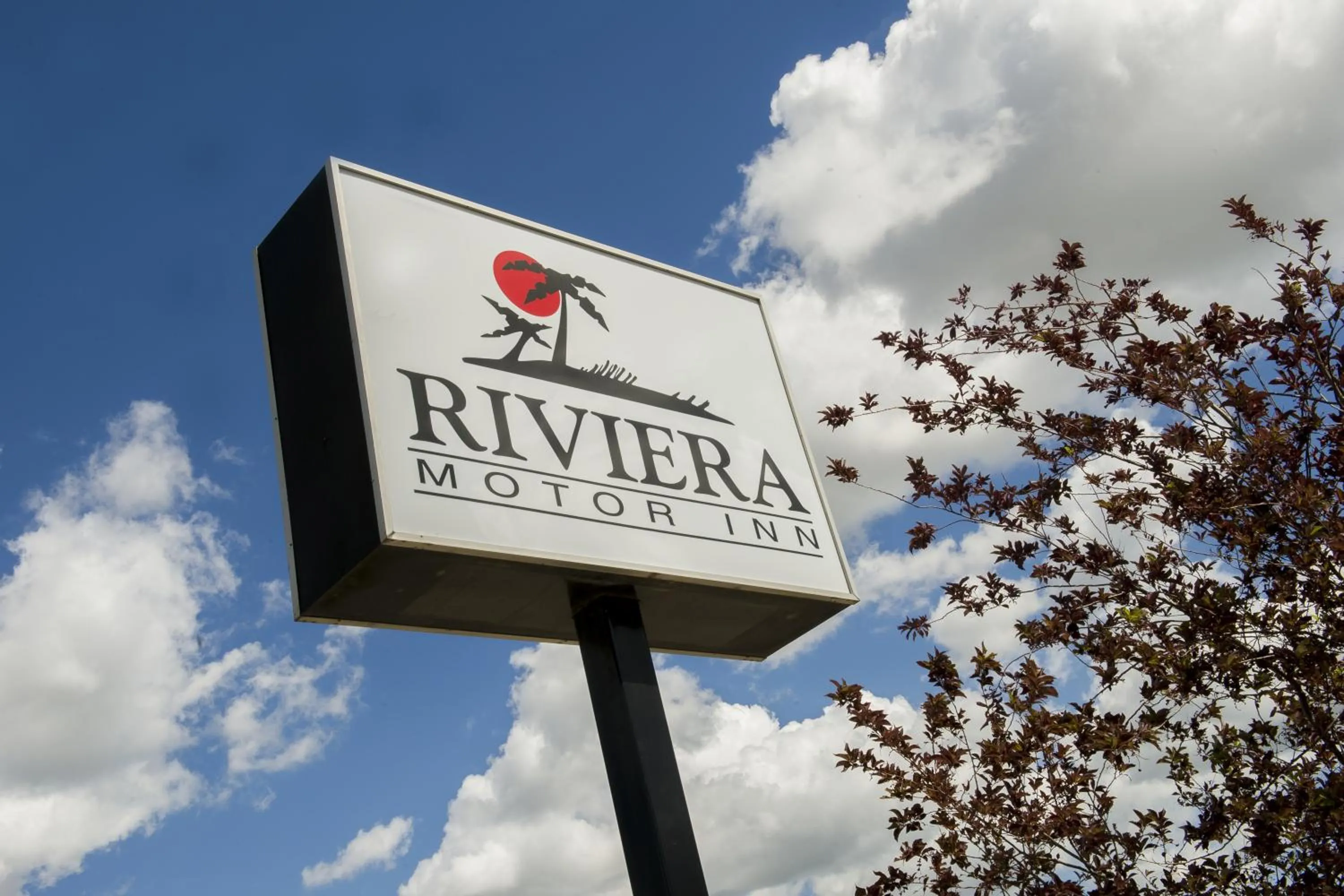 Property logo or sign in Riviera Motor Inn