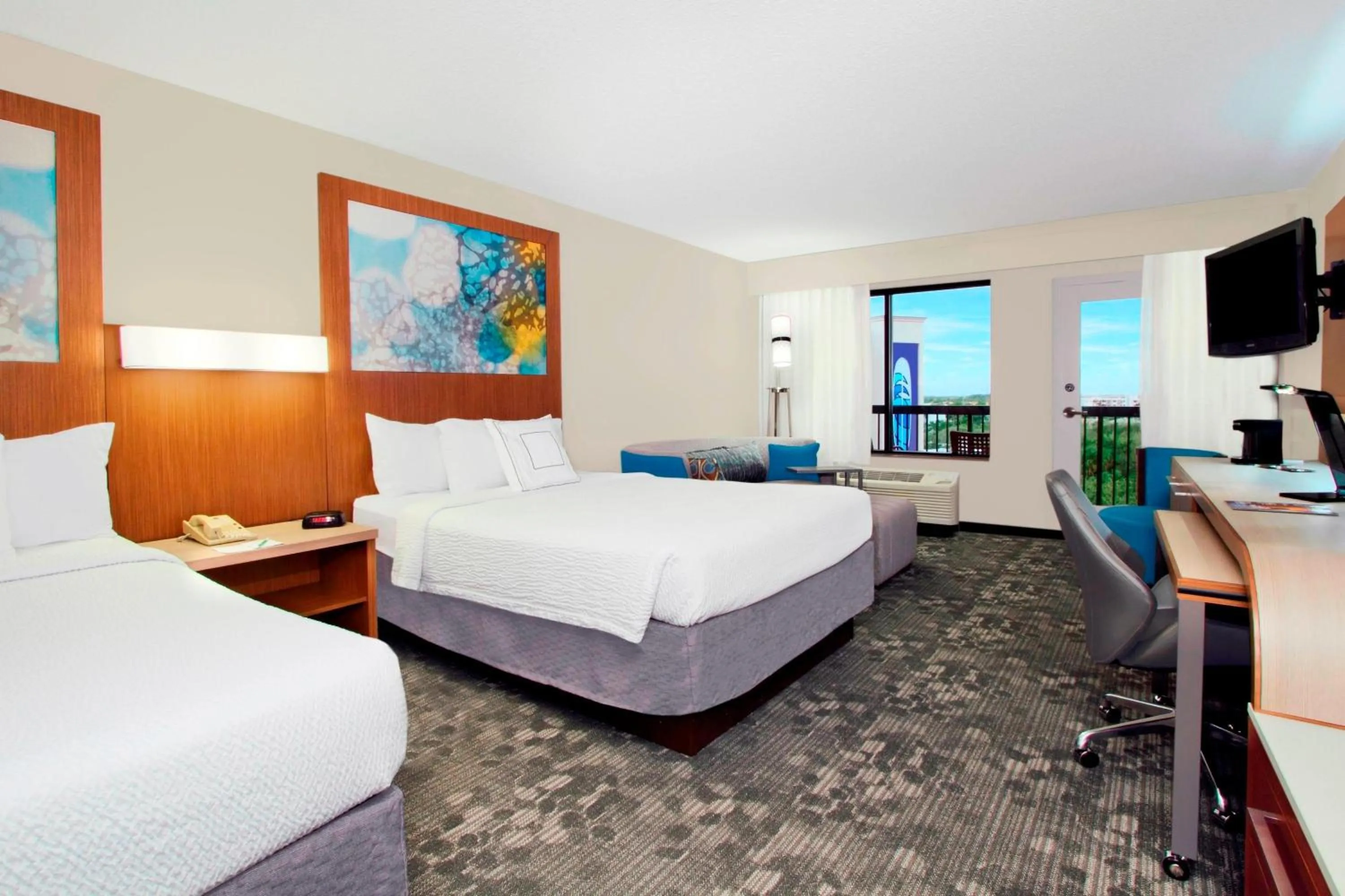 Queen Room with Two Queen Beds with Sofa Bed and Balcony in Courtyard by Marriott Cocoa Beach Cape Canaveral