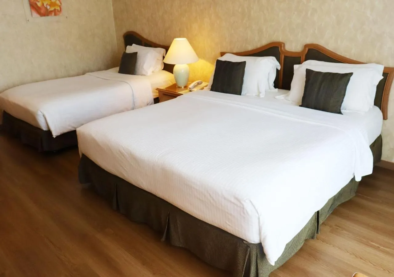 Bed in Grand Palace Hotel